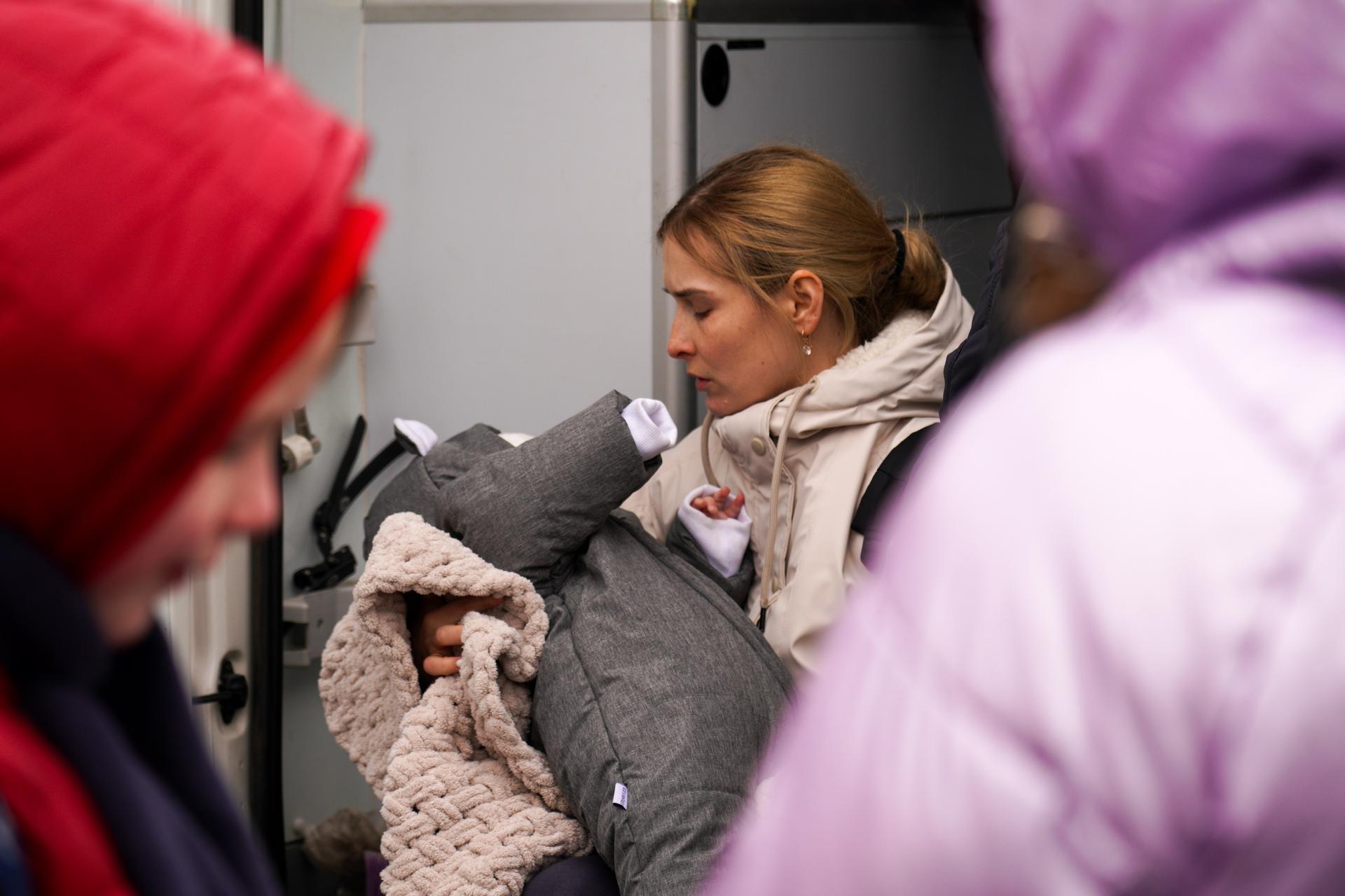 Refugees from Ukraine arrive at Siret customs at the border crossing point near the town of Suceava, in northern Romania.