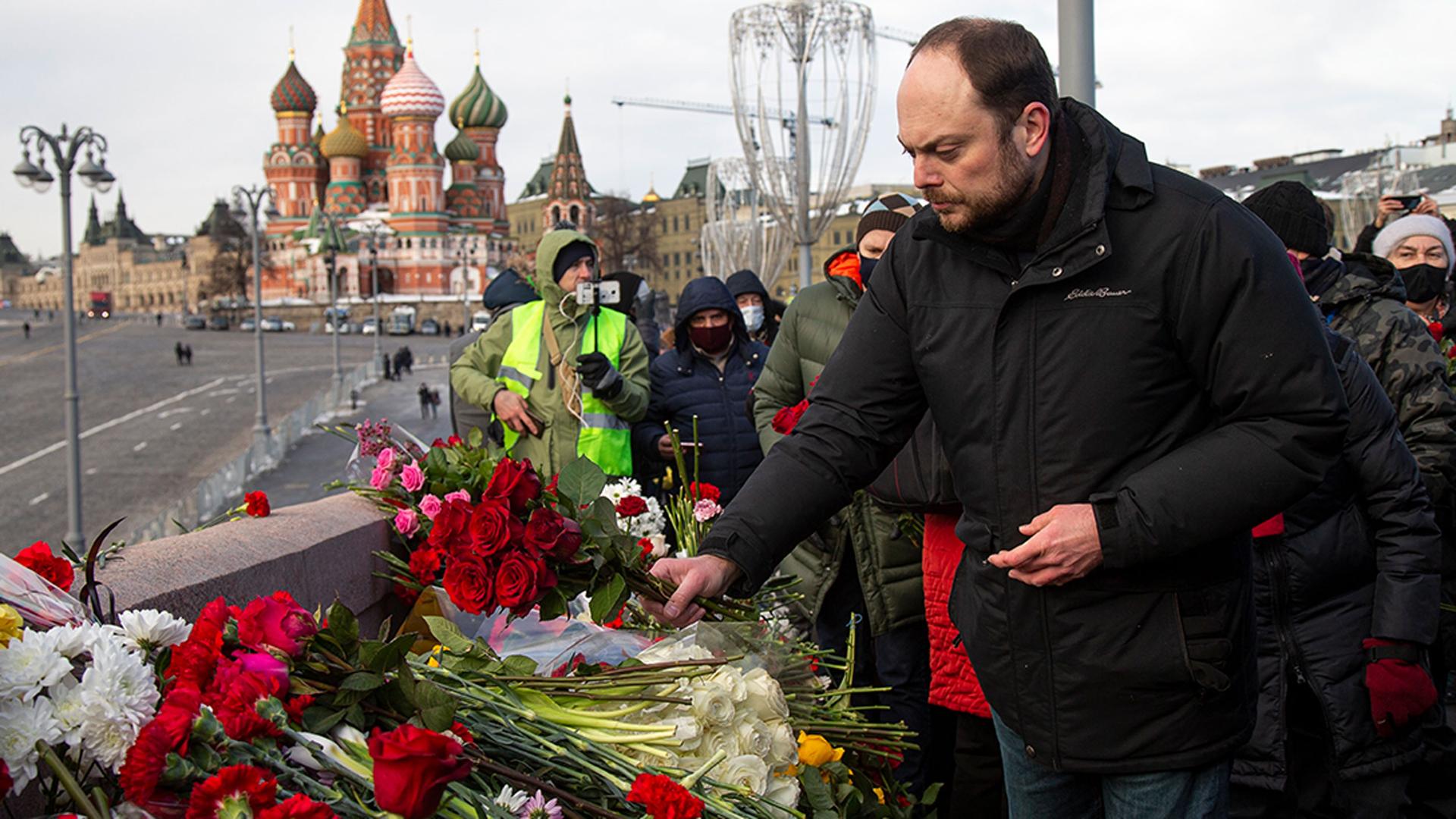 Russian opposition activist Vladimir Kara-Murza lays flowers near the place where Russian opposition leader Boris Nemtsov was gunned down, in Moscow, Russia