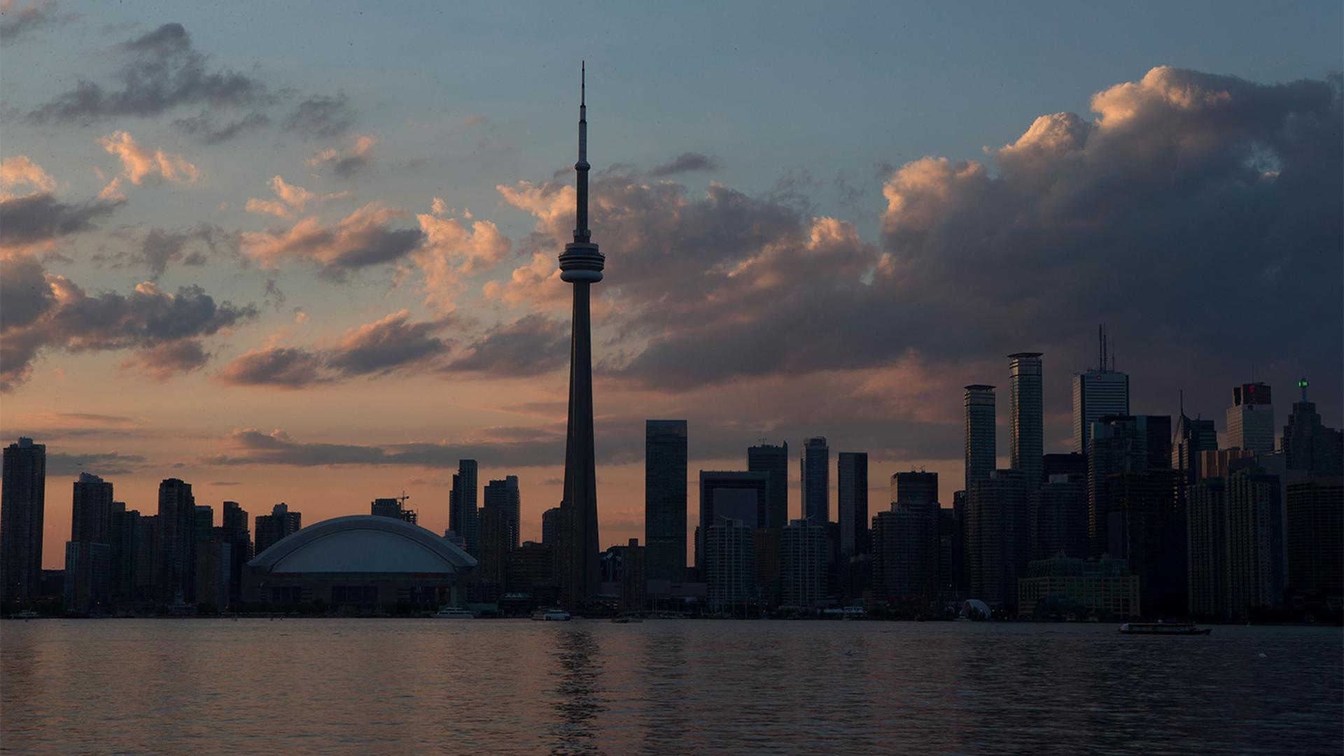 The sun sets over the Toronto skyline during the opening ceremony for the Pan Am Games