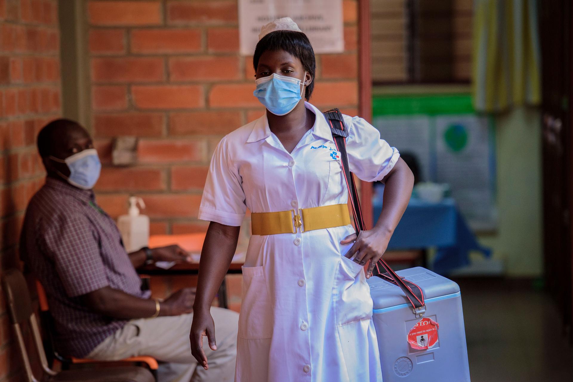 A nurse leaves after vaccinating people against the coronavirus at St. Mary's Hospital Lacor in Gulu, Uganda on Wednesday, Sept. 22, 2021. 