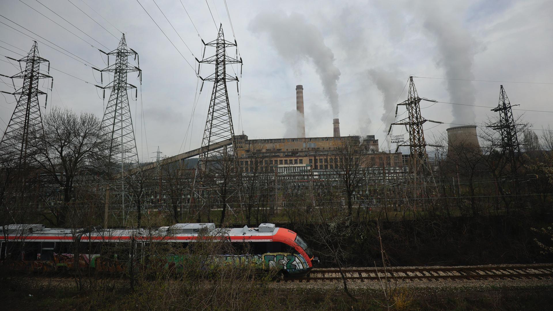 A train passes by Republika Power Plant in town of Pernik, Bulgaria, April 21, 2022. The only nuclear power plant, generating over a third of Bulgaria’s electricity, runs on uranium from Russia. 
