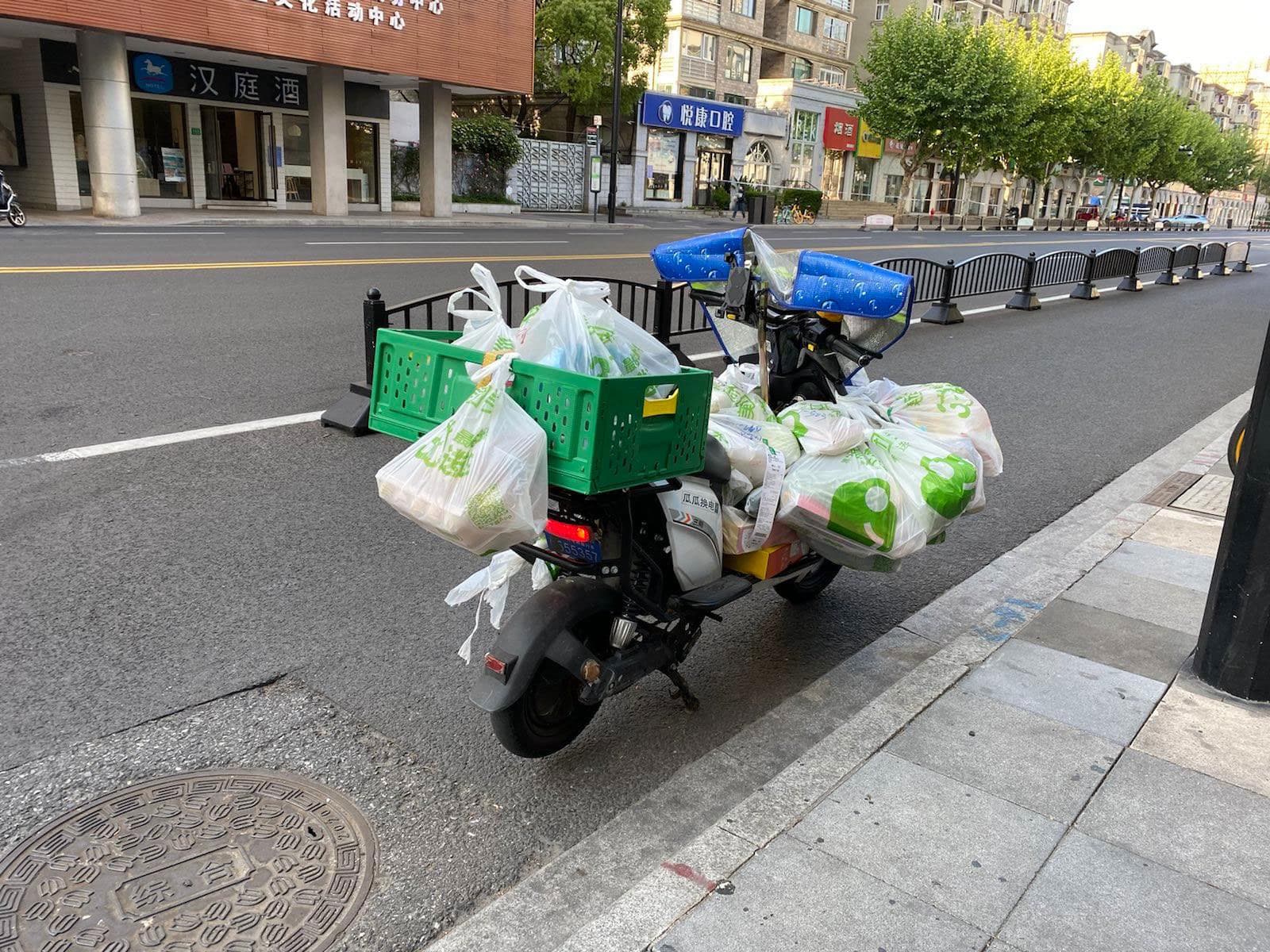 Drivers' bikes get weighed down with plastic bags full of groceries or other essentials.