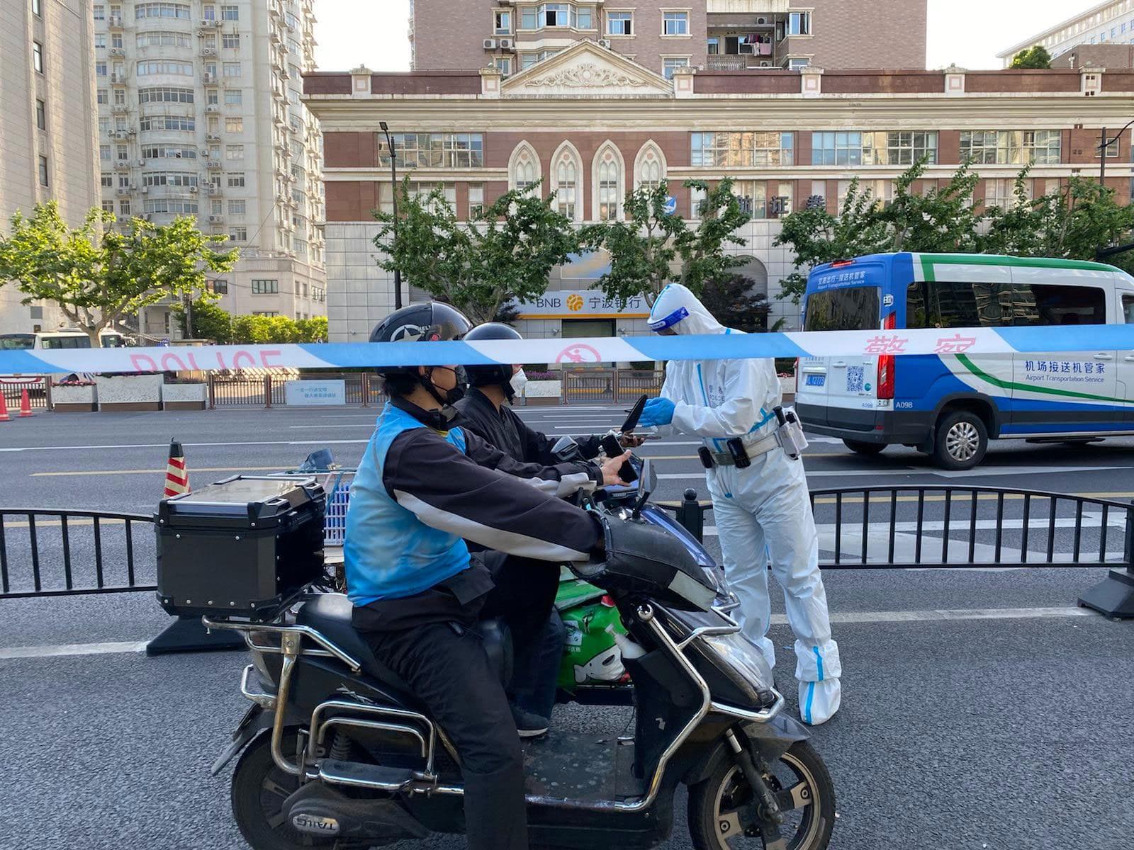 Police are checking courier’s passes at traffic lights.