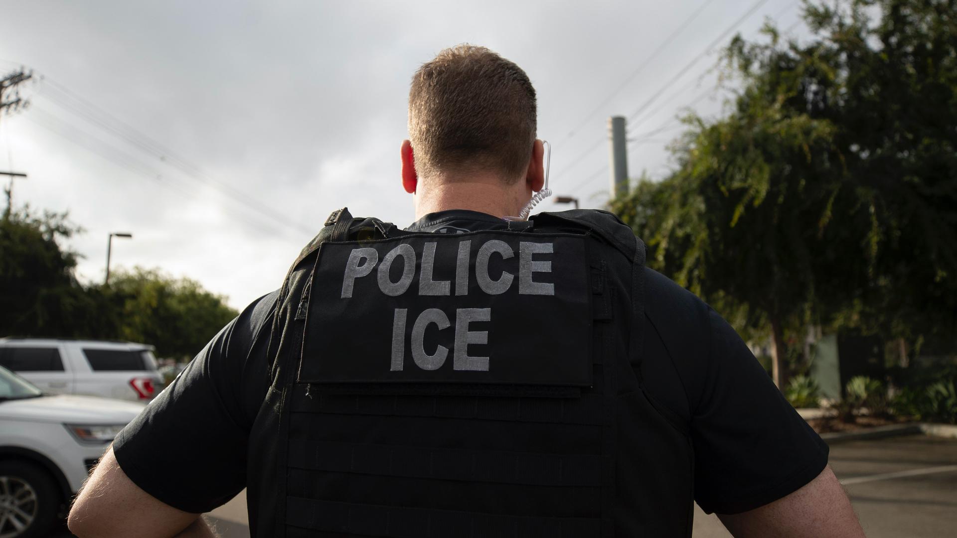 an ICE agent's back