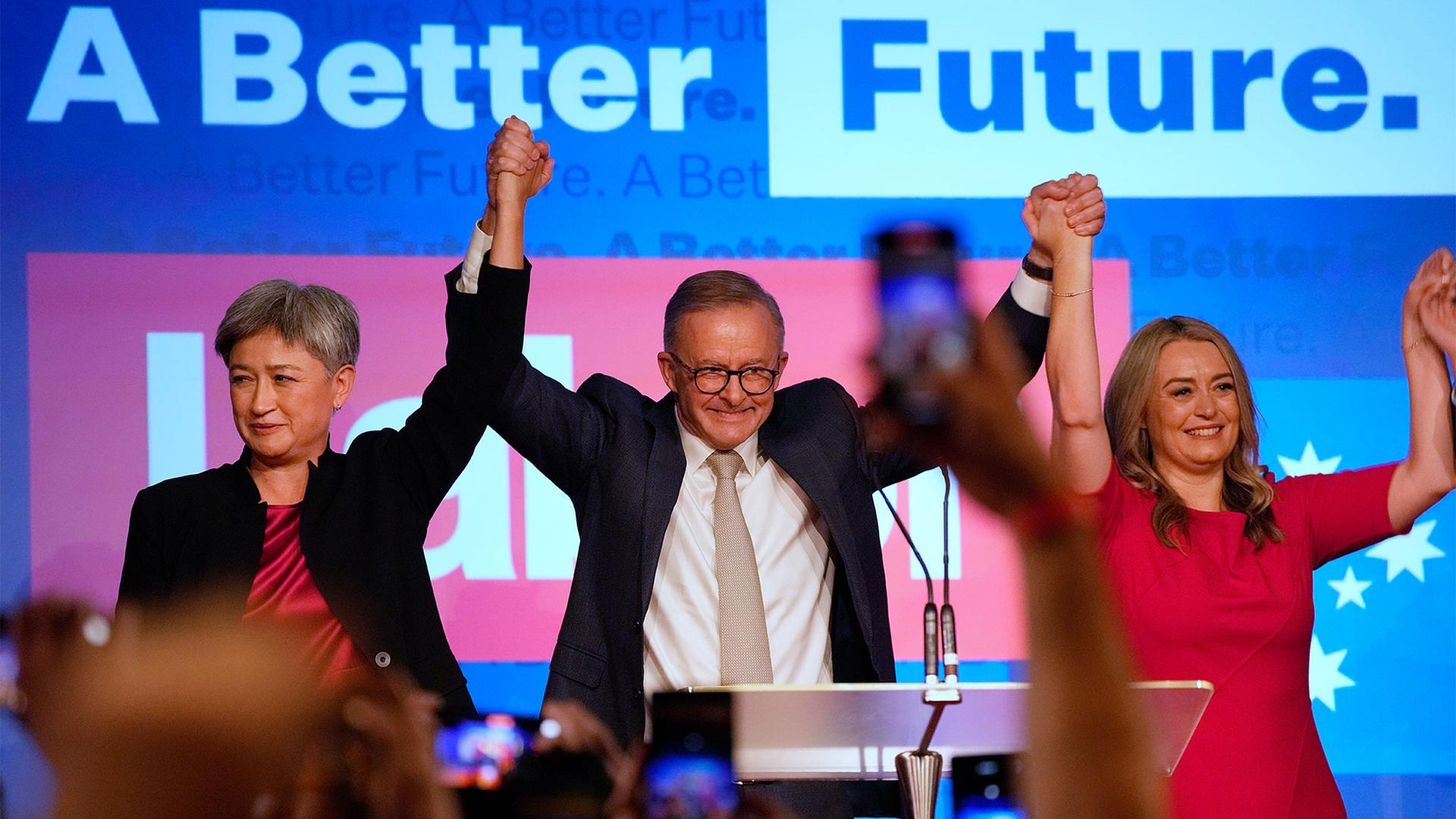 Labor Party leader Anthony Albanese, center back, celebrates with his partner partner Jodie Haydon, right, and Labor senate leader partner Penny Wong at a Labor Party event in Sydney, Australia