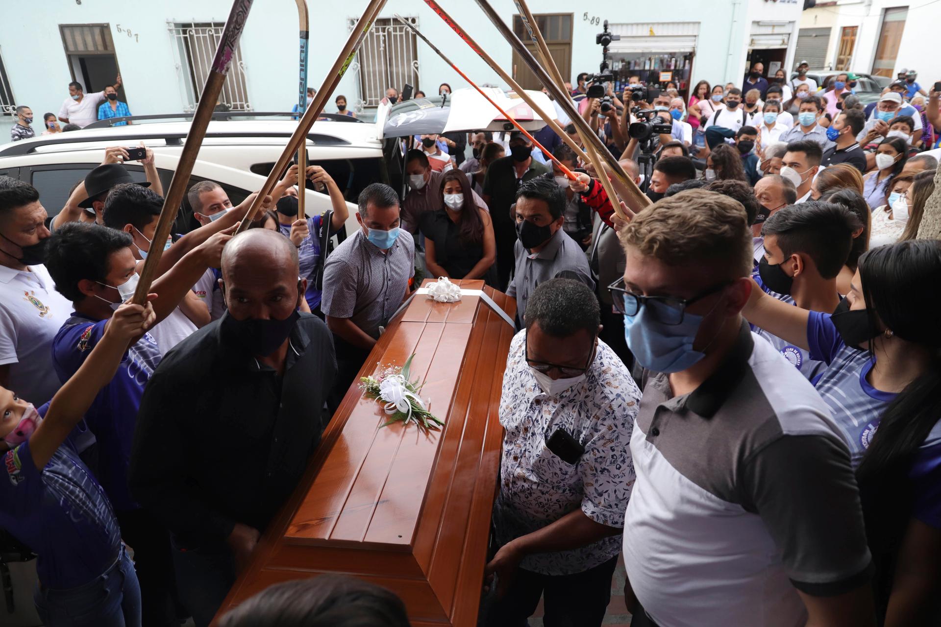 Relatives and friends of Jacobo Alberto Perez, one of the five young people who was killed by unidentified gunmen last Saturday, carry his coffin during his funeral in Buga, Colombia, Monday, Jan. 25, 2021. 