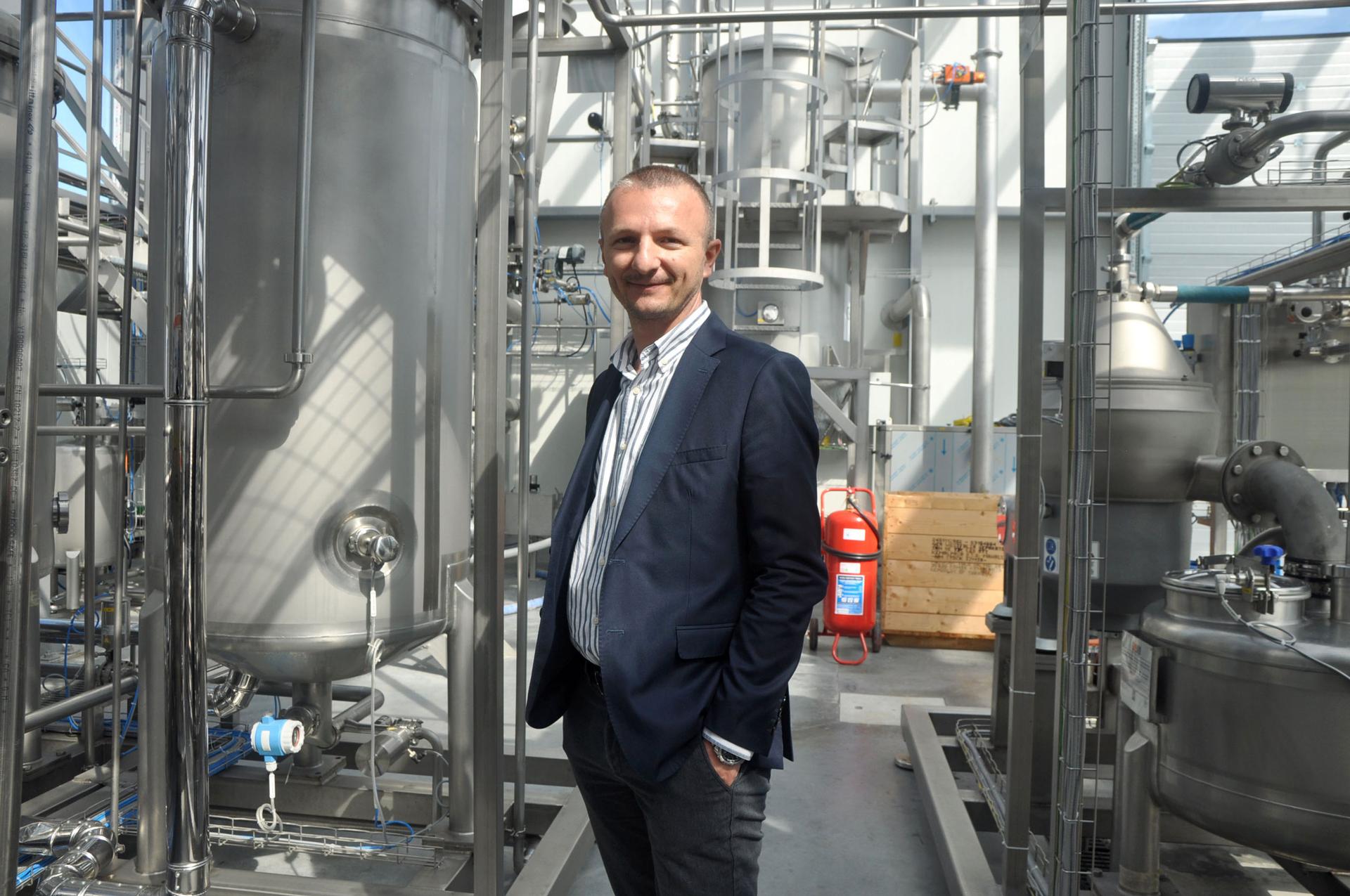 Berat Haznedaroğlu, director of the Istanbul Microalgae Biotechnologies Research and Development Center, stands amid equipment used to extract lipids from microalgae and convert them into fatty acids. After testing for quality, the oil is shipped off to a
