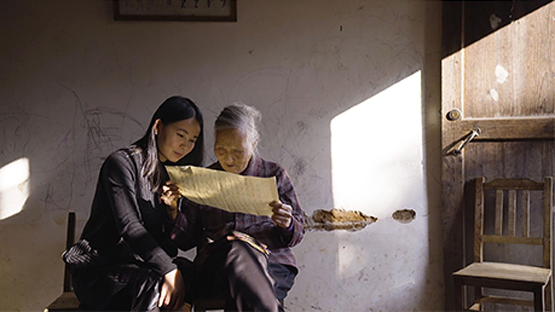 Hu Xin and He Yan Xin as seen in the film "Hidden Letters"
