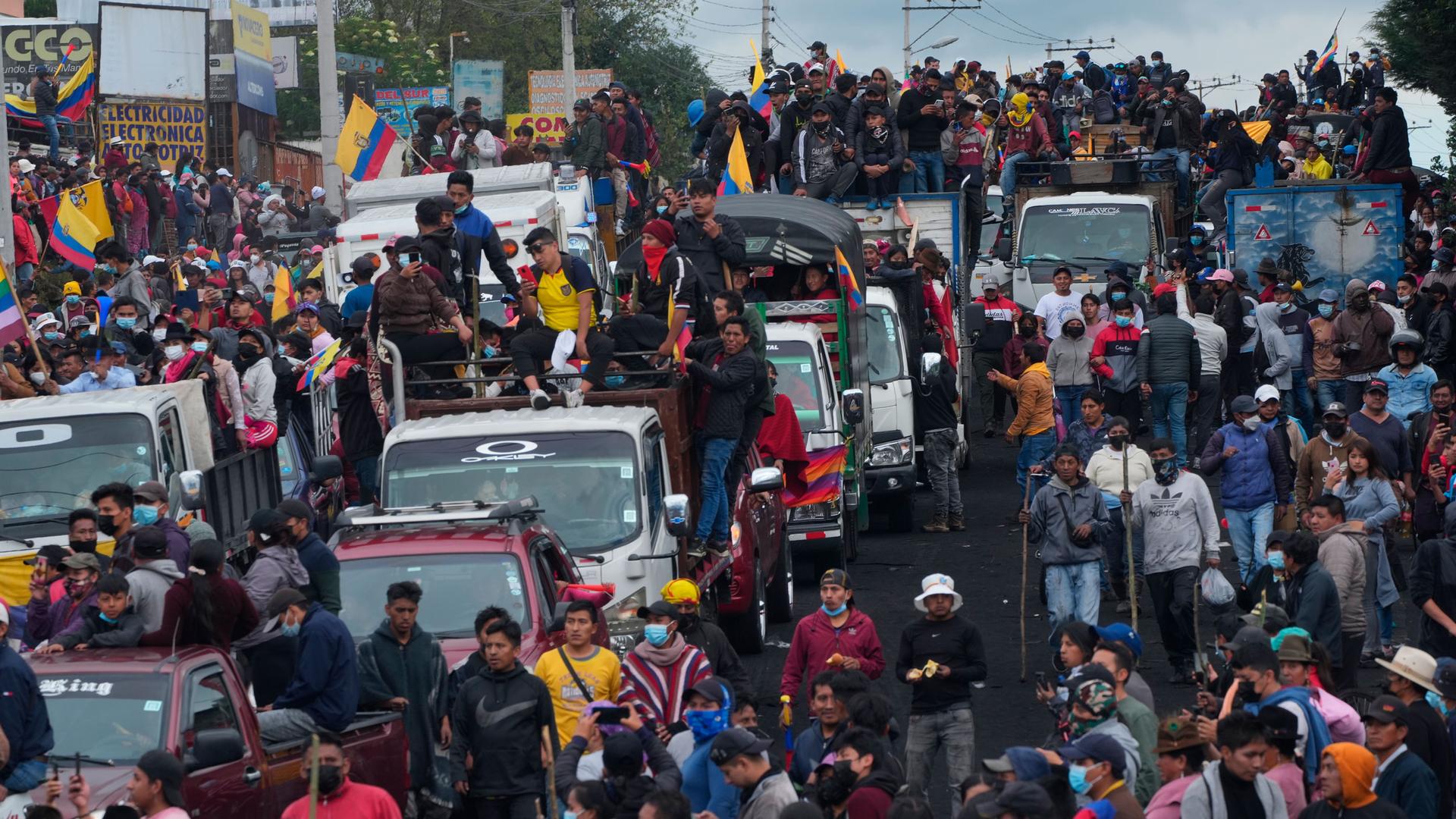 Demonstrators ride trucks as they arrive to the capital to protest against the government of President Guillermo Lasso, in Quito, Ecuador, Monday, June 20, 2022. 