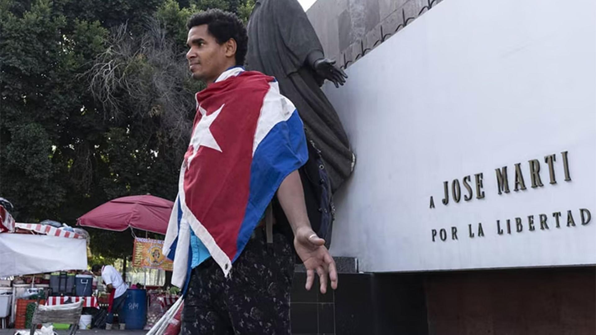 Otero Alcántara during his performance “La Bandera Es De Todos," a piece where he wore the Cuban flag for thirty days.