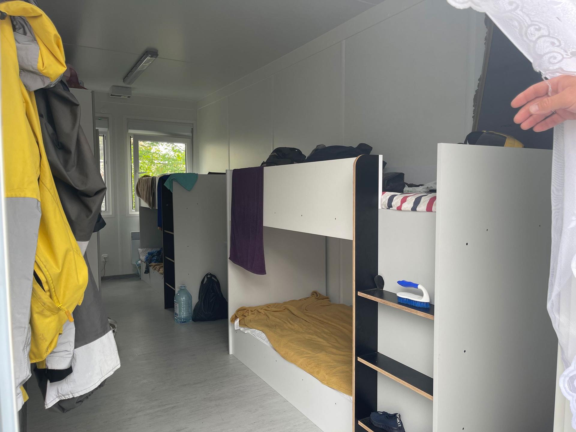 Each module is 130-square feet and includes four beds, shelves and a place to hang clothes.