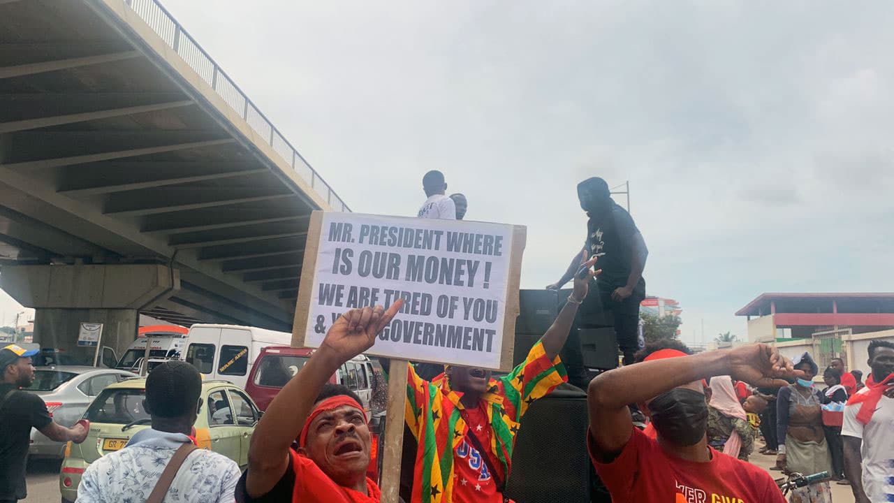 Protesters wield placards asking, "Mr. President, where is our money" at a recent protest against soaring food and fuel prices.