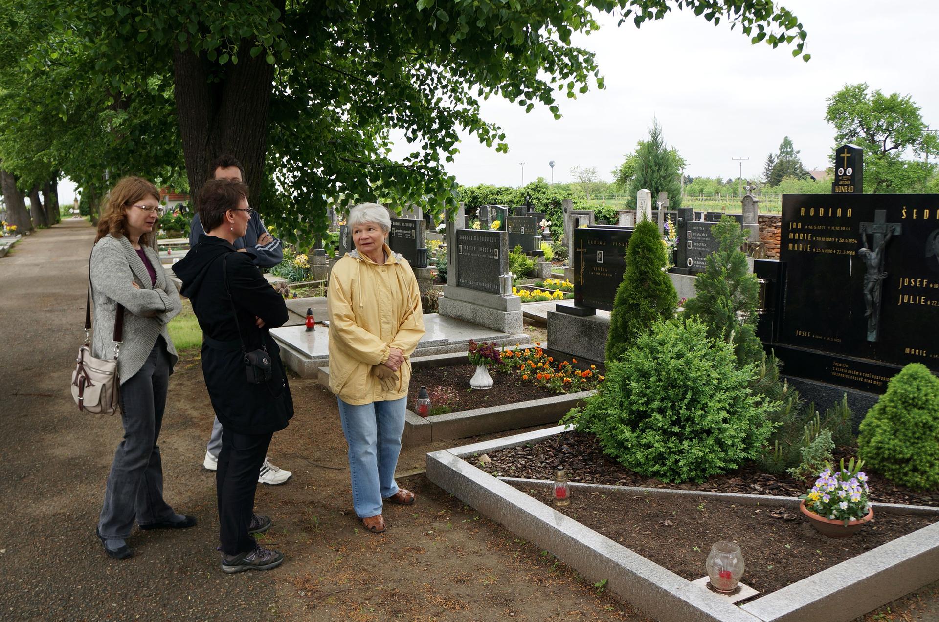 Julie Sedivy and other family members visiting her father’s family gravesite in his village of Moravská Nová Ves. 
