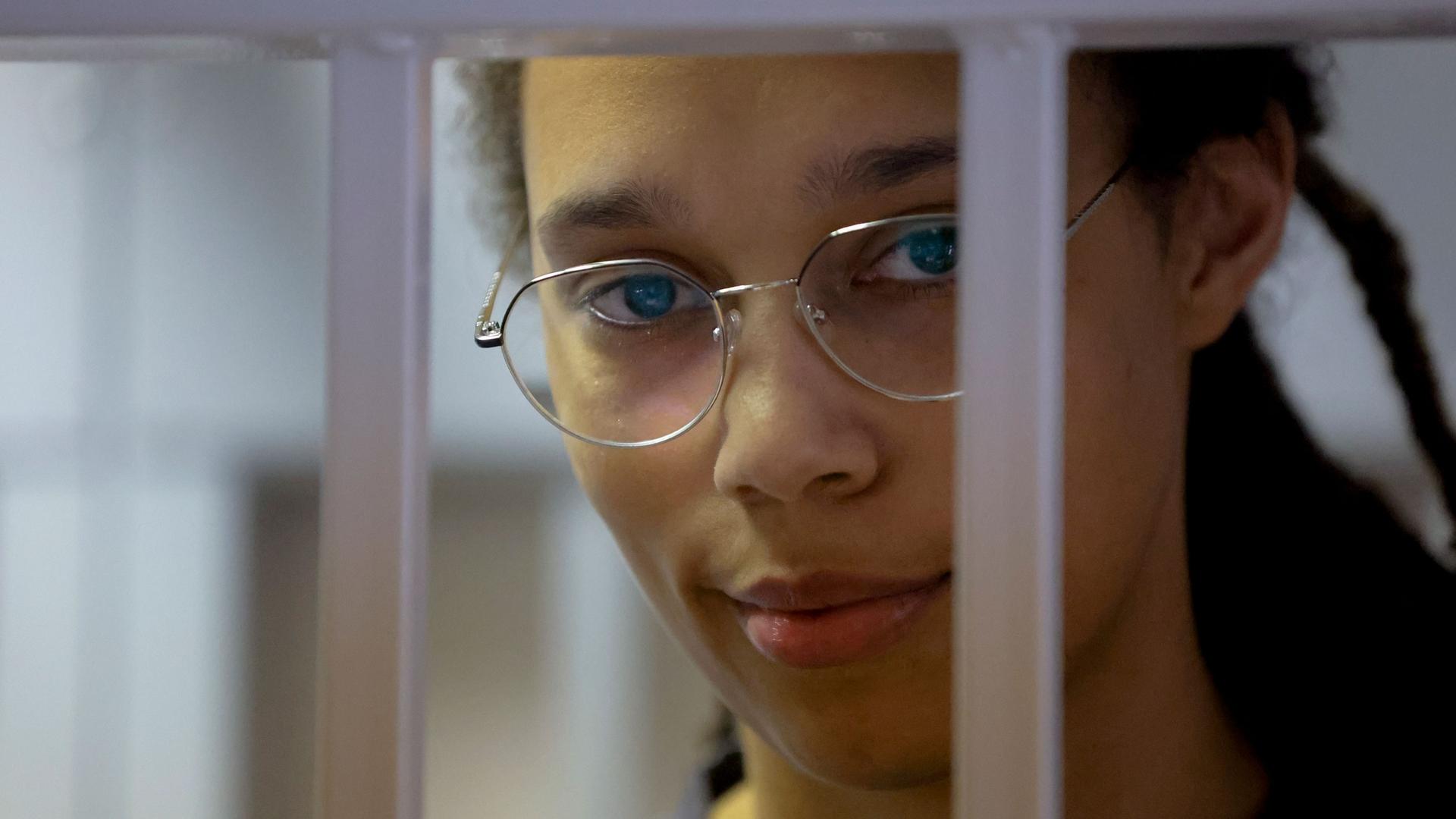 WNBA star and two-time Olympic gold medalist Brittney Griner stands in a cage in a courtroom prior to a hearing in Khimki just outside Moscow, Russia, Thursday, Aug. 4, 2022. 