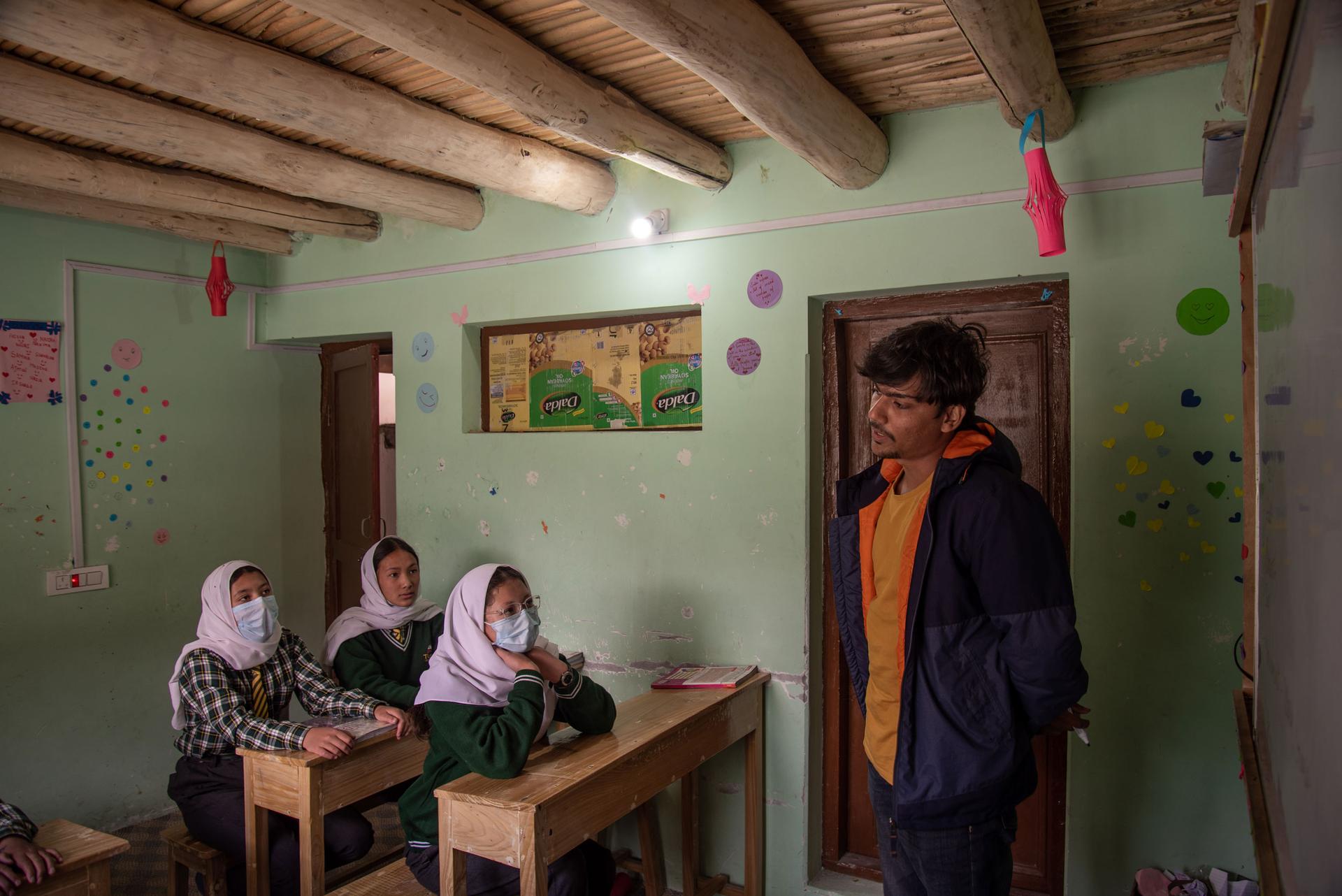 Yash Raj, 22, interacts with sixth grade students, at Turtuk Valley School.