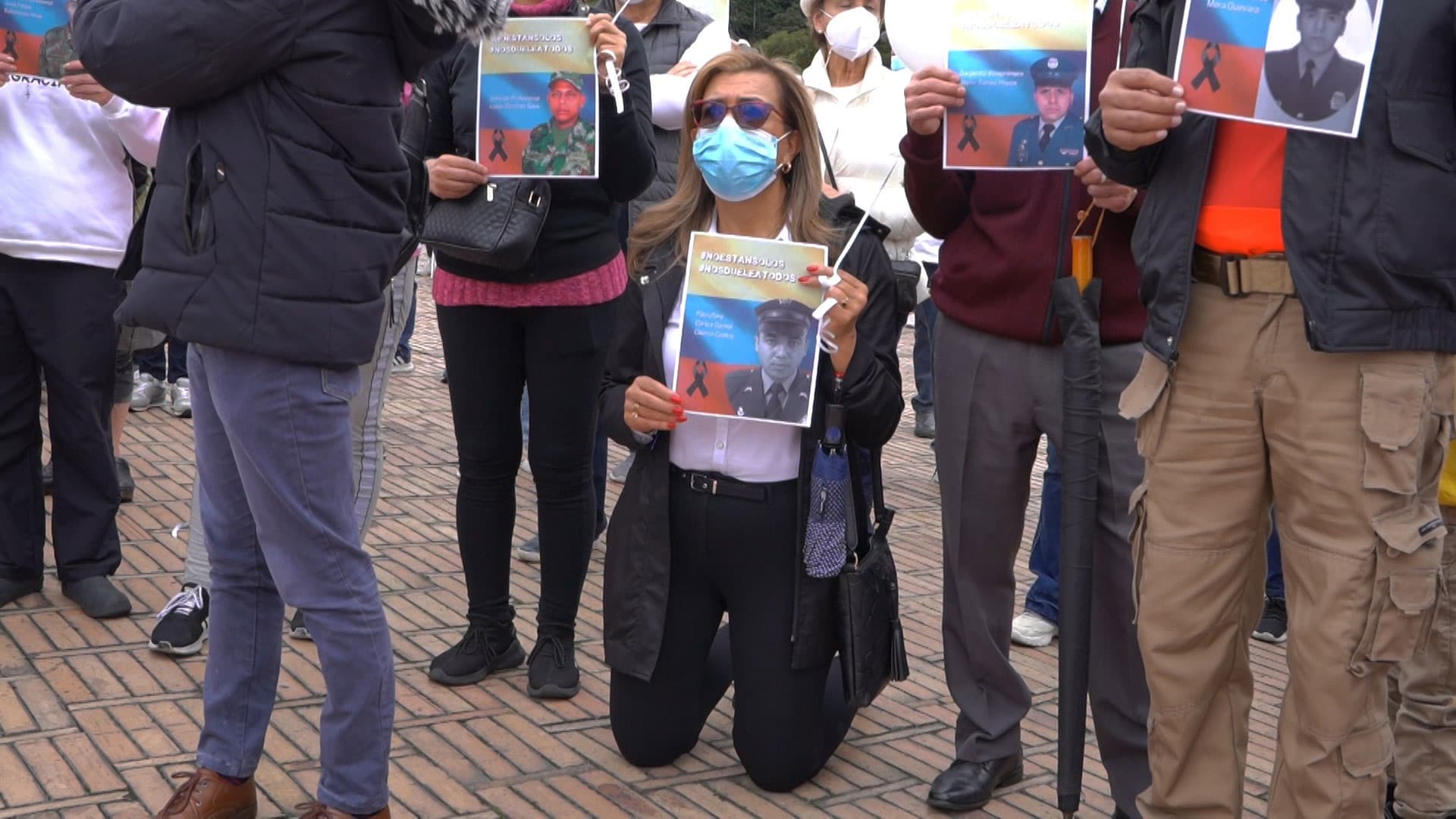At an outdoor mass in Bogotá, people prayed for the police officers who have been killed recently.