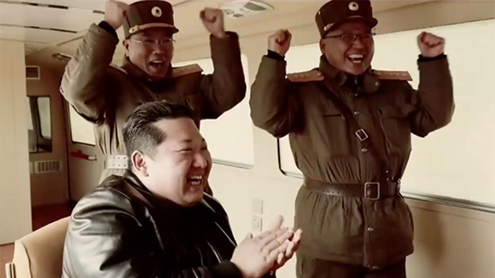 Kim Jong-un and his generals cheer after the apparent launch of the Hwasong-17 long-range missile in March