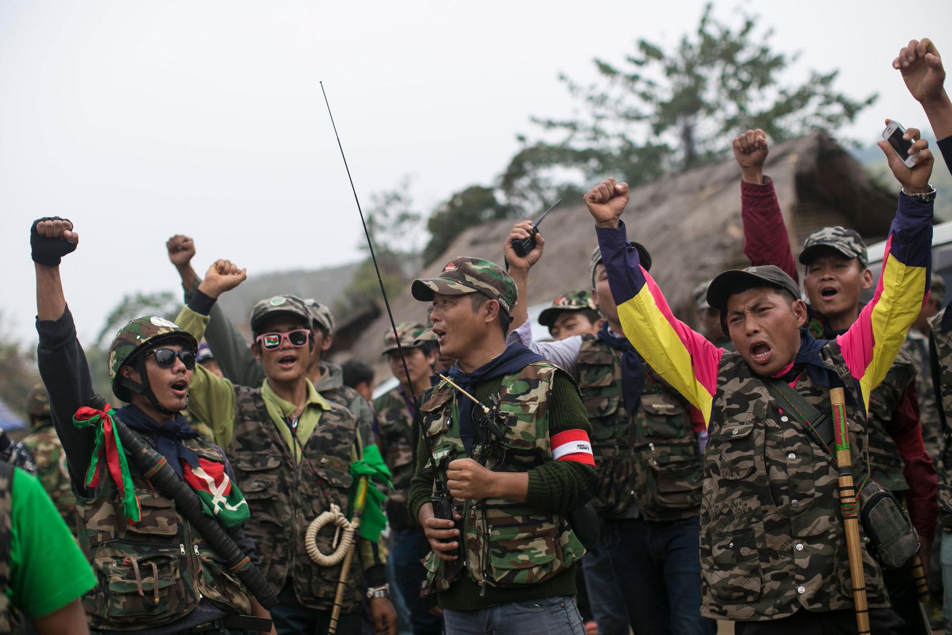 Members of community based anti-narcotic campaigners known as The Pat Jasan shout slogans protesting against the government’s ban prohibiting the group from destroying poppy farms in Wai Maw, northern Kachin State, Myanmar, Sunday Feb. 21, 2016. 
