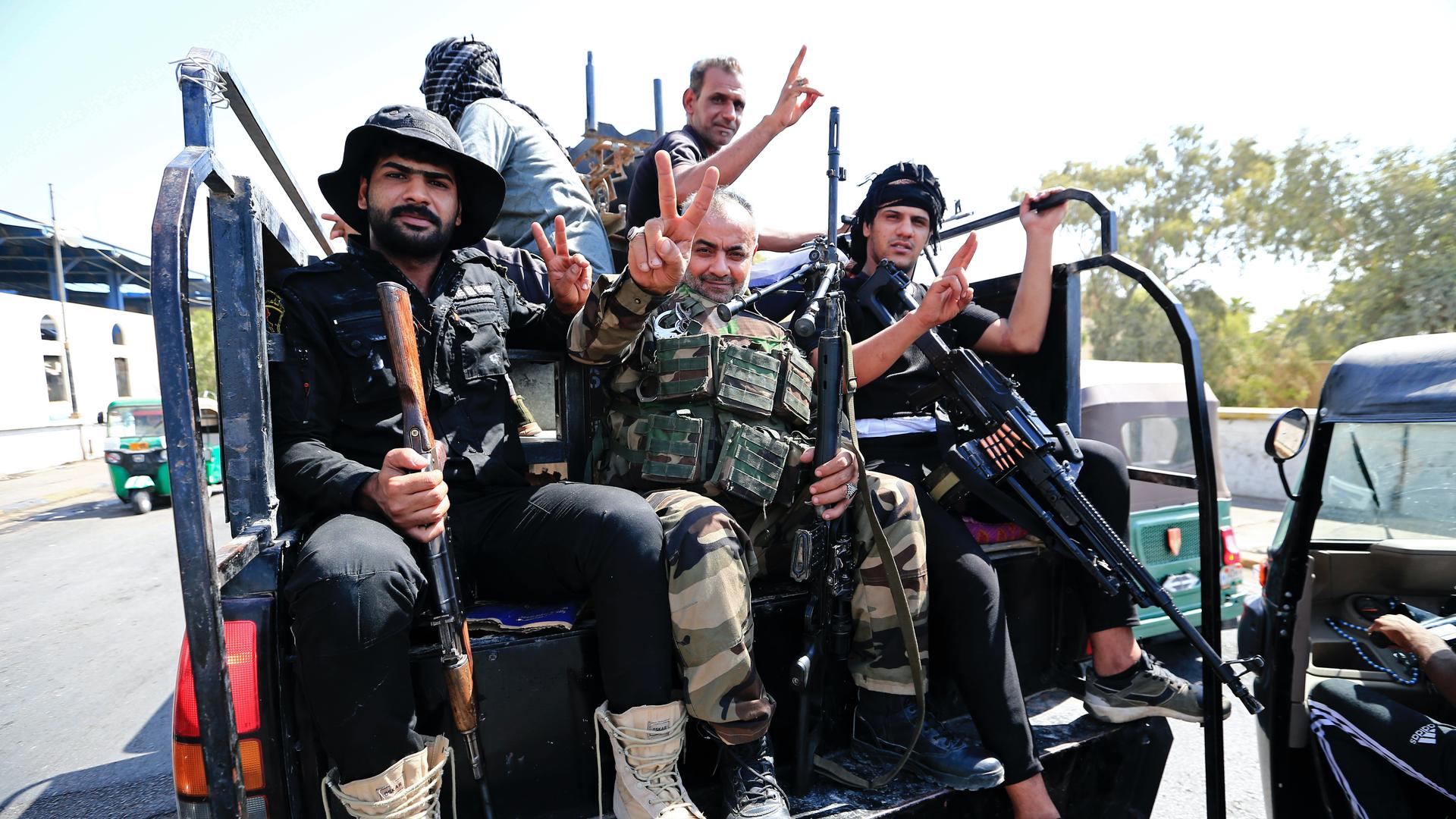 Fighters from the Saraya Salam (Peace Brigades) loyal to influential Shia Iraqi cleric Muqtada al-Sadr deploy in Baghdad, Iraq, Aug. 30, 2022. 