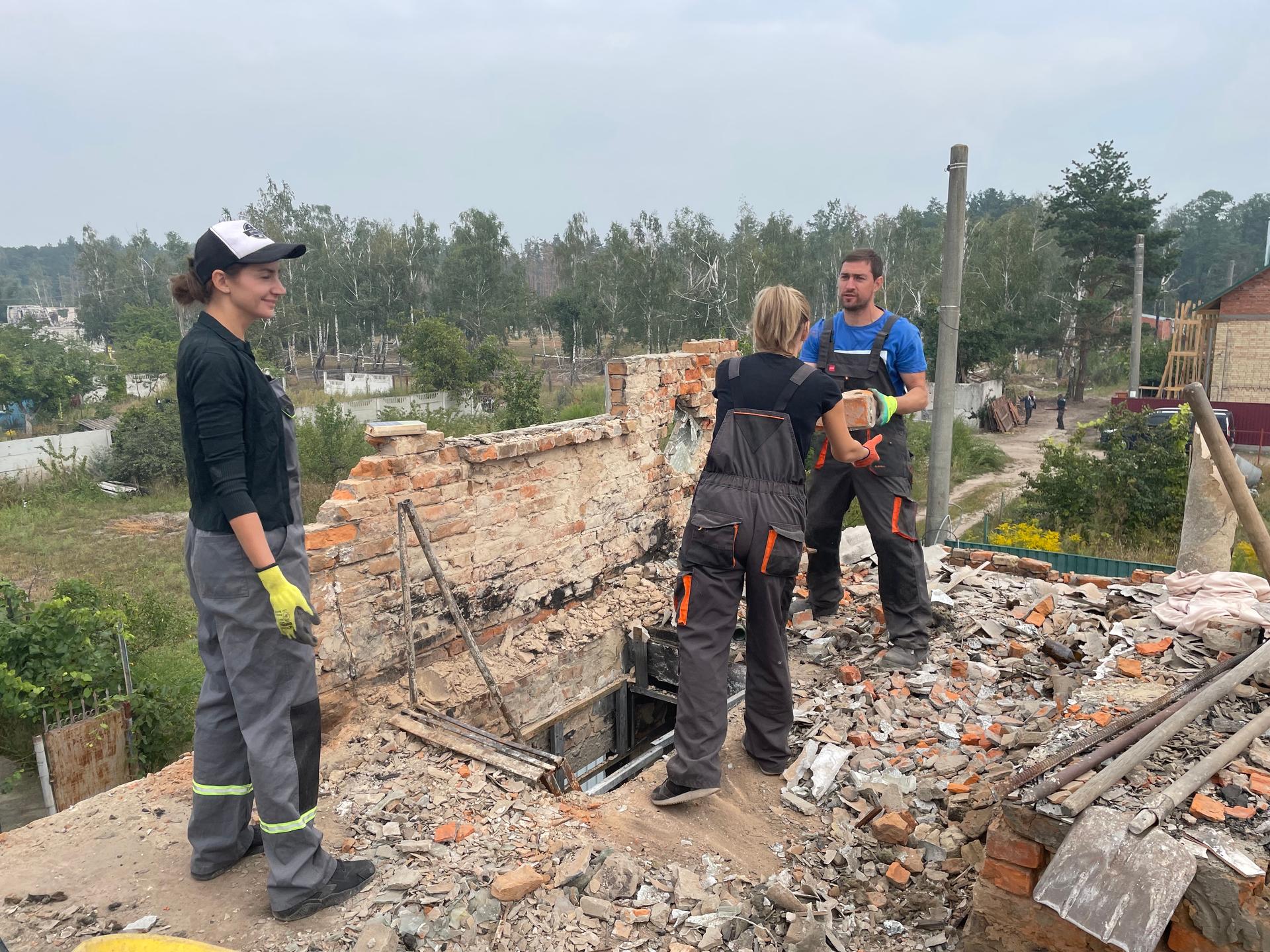 people helping to rebuild