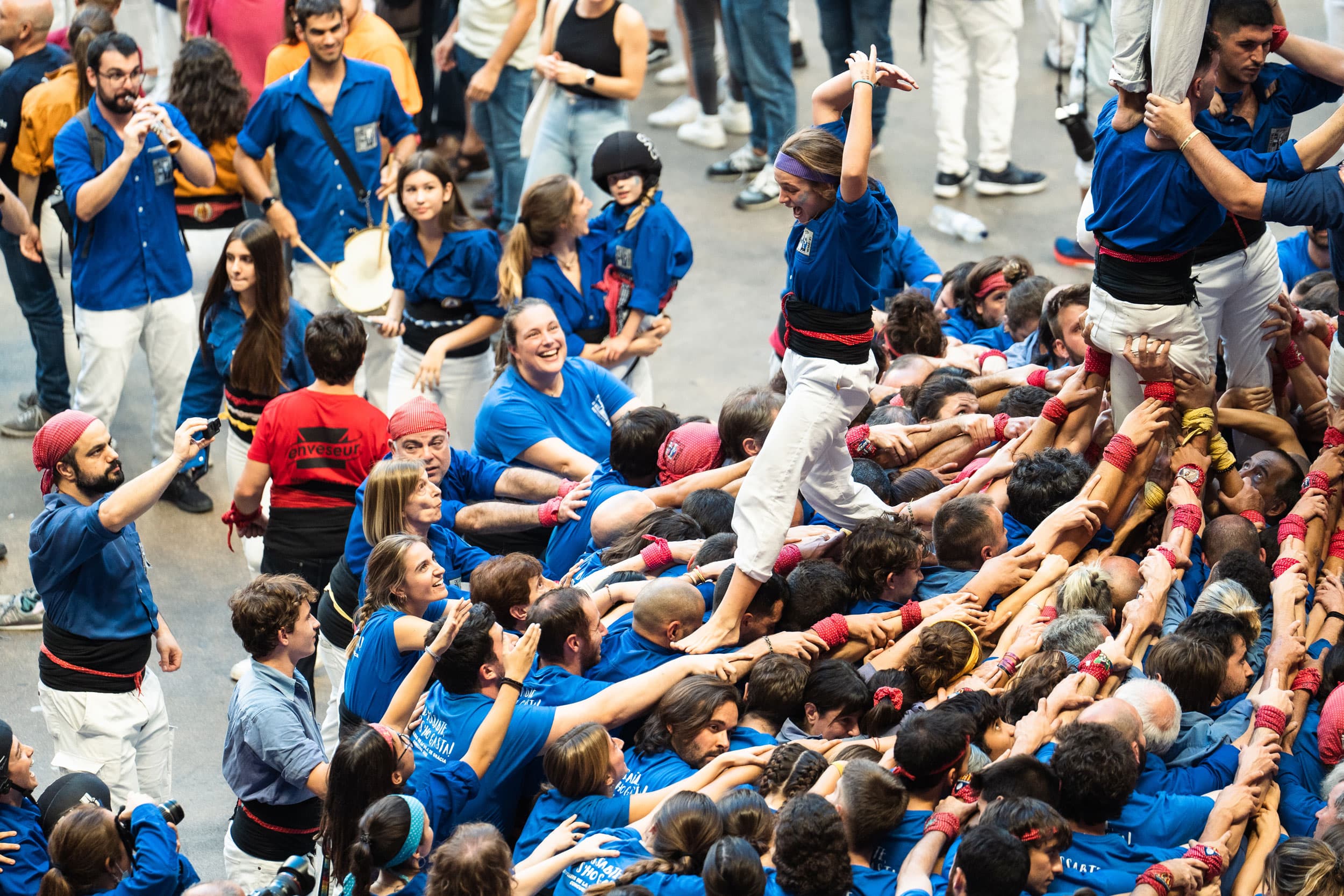 Castellers de la Vila de Gràcia team competes in a human tower competition in Catalonia.