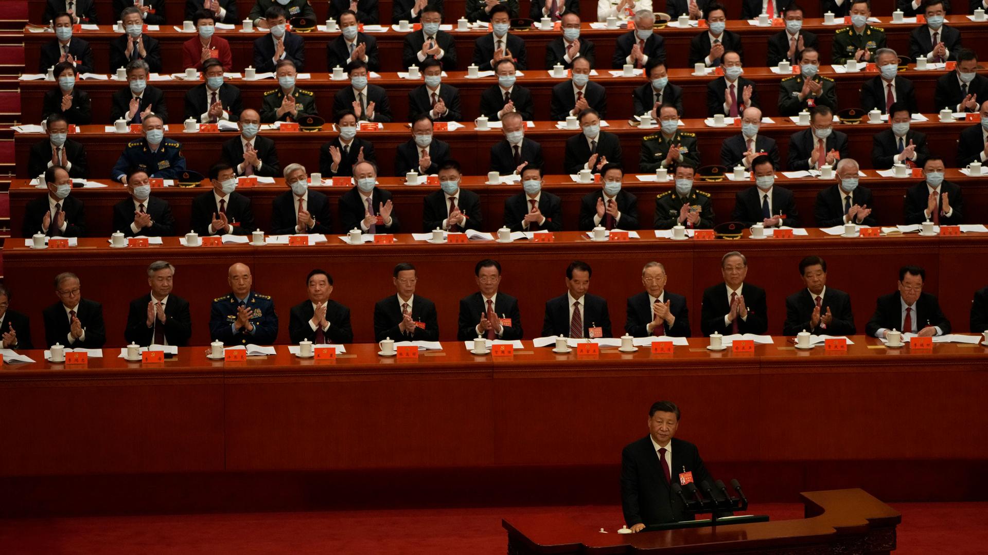 Delegates applaud as Chinese President Xi Jinping speaks during the opening ceremony of the 20th National Congress of China's ruling Communist Party held at the Great Hall of the People in Beijing, China, Sunday, Oct. 16, 2022. 