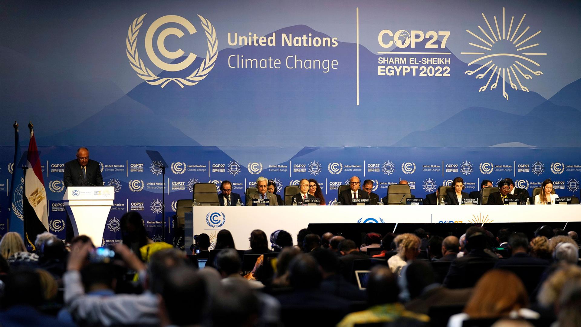 Sameh Shoukry, president of the COP27 climate summit, left, speaks during an opening session at the COP27 UN Climate Summit in Sharm el-Sheikh, Egypt
