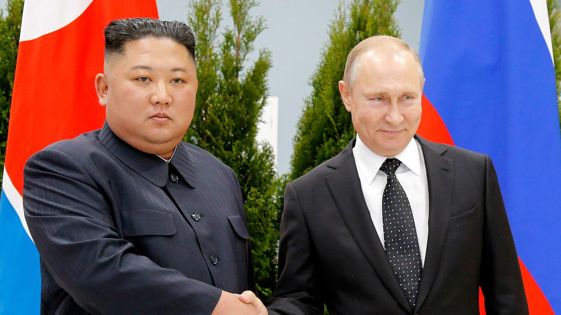 Russian President Vladimir Putin, right, and North Korea's leader Kim Jong-un shake hands during their meeting in Vladivostok, Russia on April 25, 2019. 