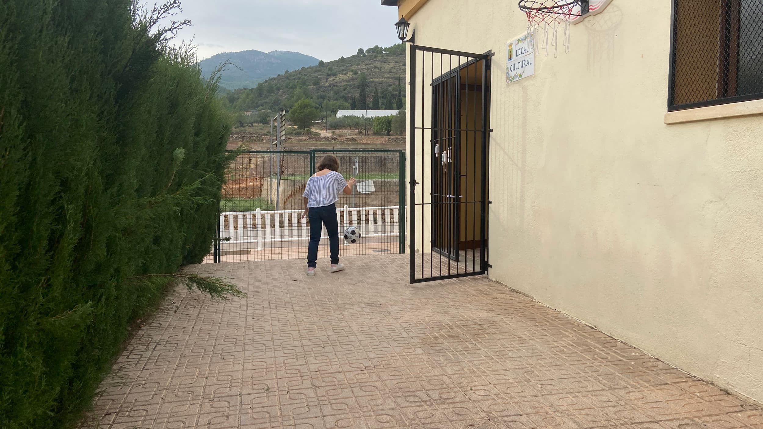 A student at Argelita’s new school plays in the small courtyard.