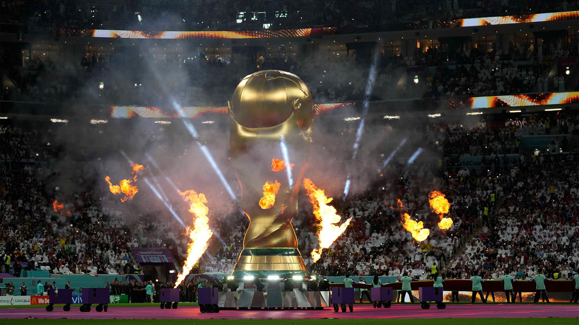 A giant inflatable copy of the trophy is displayed prior to the start of the World Cup group A soccer match between Qatar and Ecuador at the Al Bayt Stadium in Al Khor, Qatar, Nov. 20, 2022.