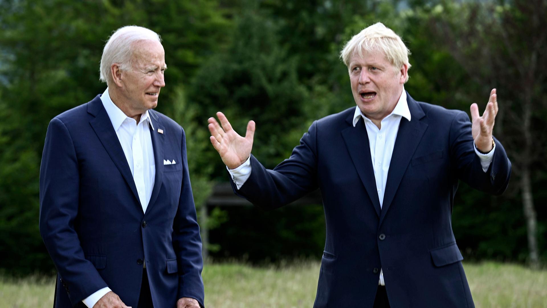 US President Joe Biden and Britain's Prime Minister Boris Johnson, right, chat as they gather for a group photo at Castle Elmau in Kruen, near Garmisch-Partenkirchen, Germany, on Sunday, June 26, 2022. 