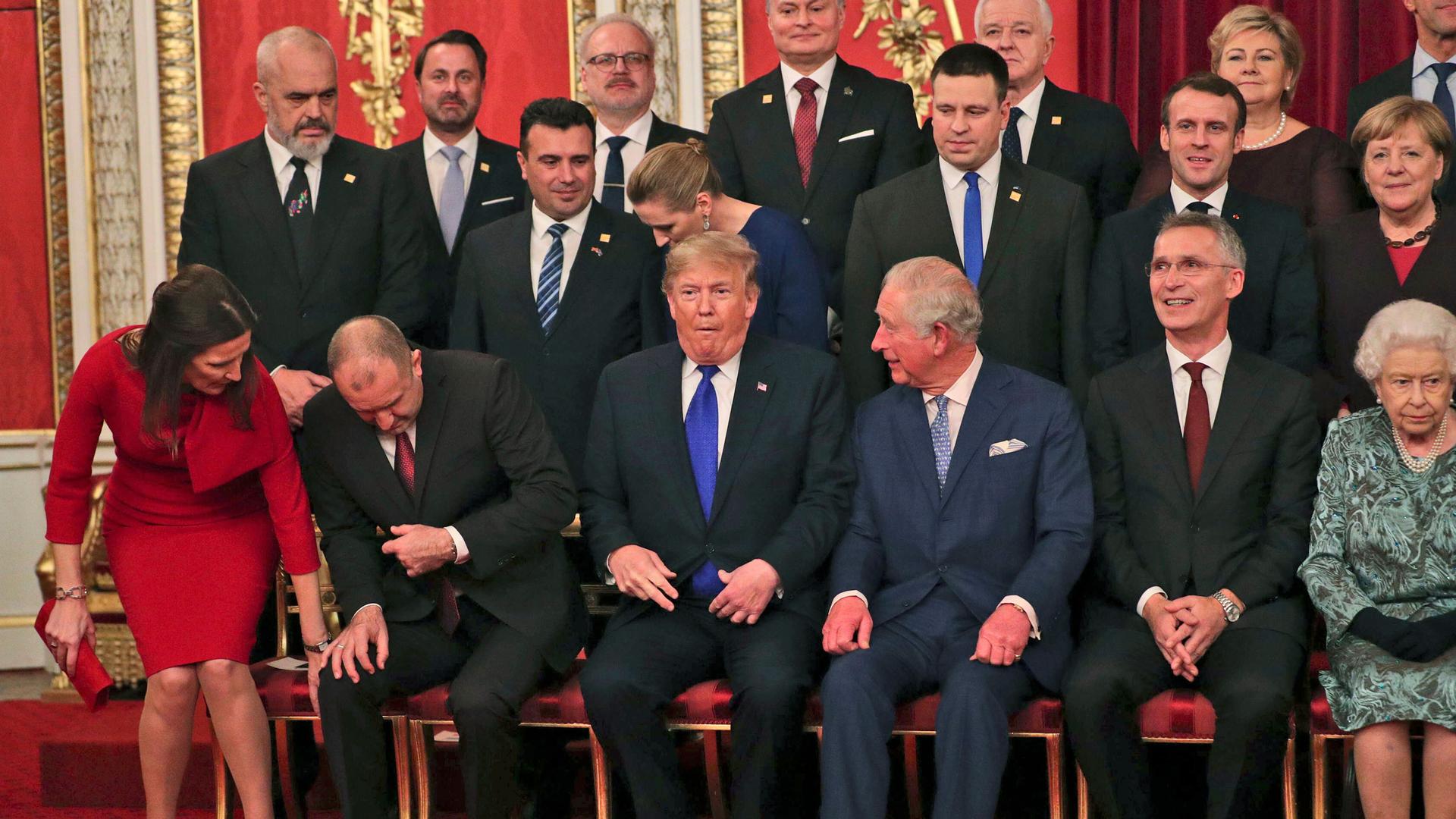 US President Donald Trump, centre left, and the Prince Charles The Prince of Wales, centre right, join other NATO leaders before posing for a formal group photo