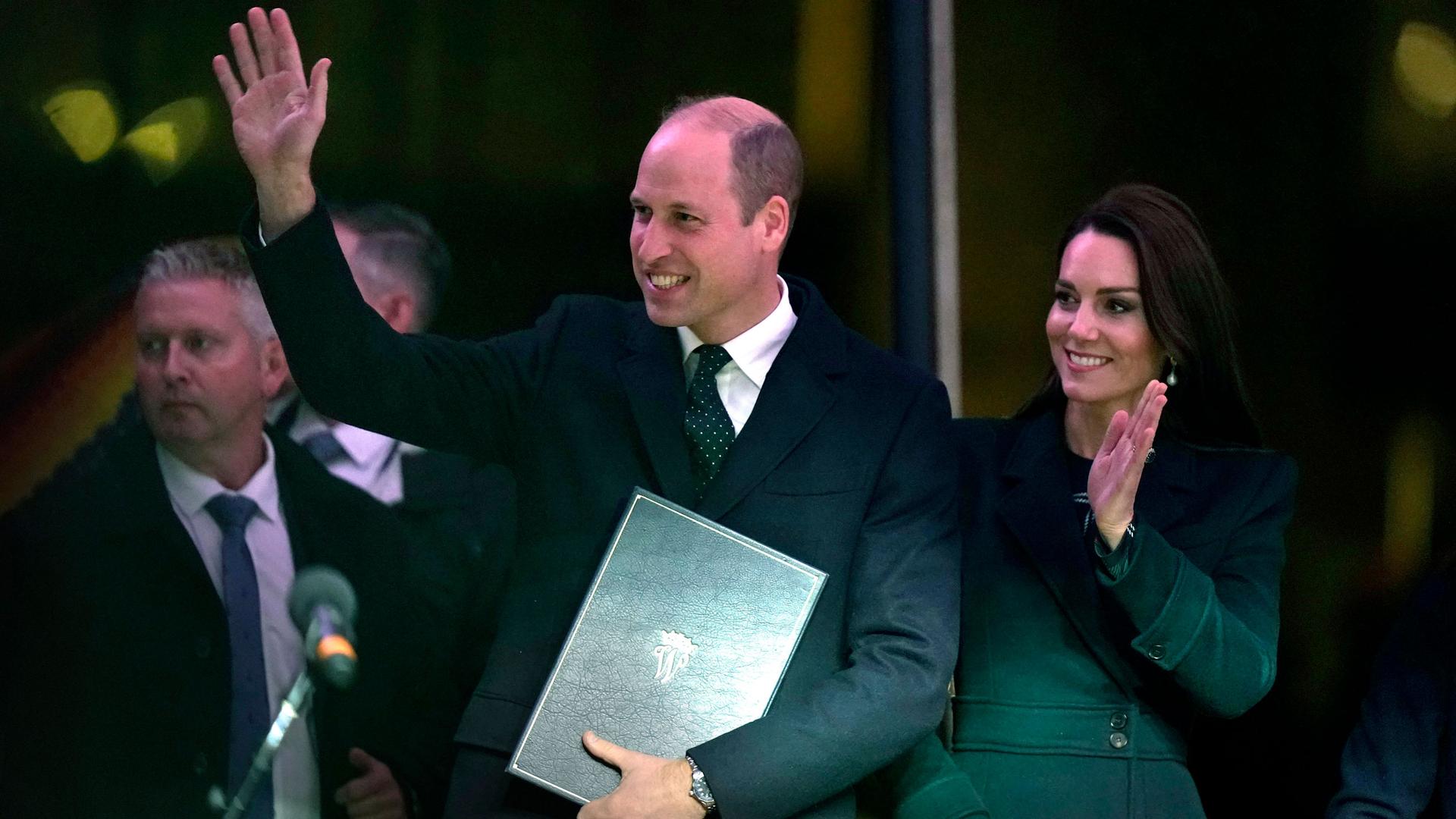 Britain's Prince William and Kate, Princess of Wales, wave to an audience as they take to the stage during ceremonies, Wednesday, Nov. 30, 2022, in Boston.