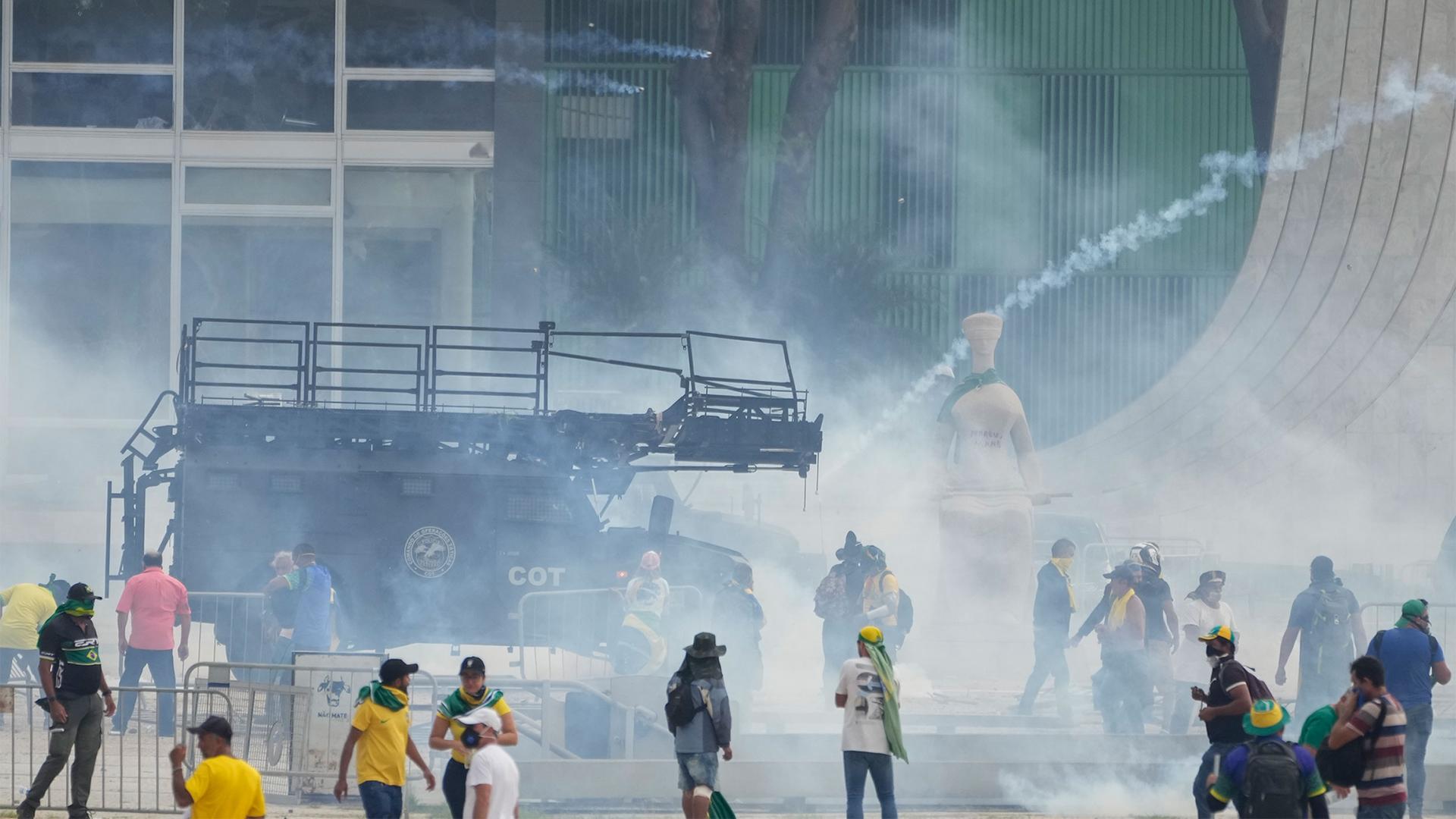 Protesters, supporters of Brazil's former President Jair Bolsonaro, clash with the police after they stormed the Planalto Palace in Brasilia, Brazil, Jan. 8, 2023.