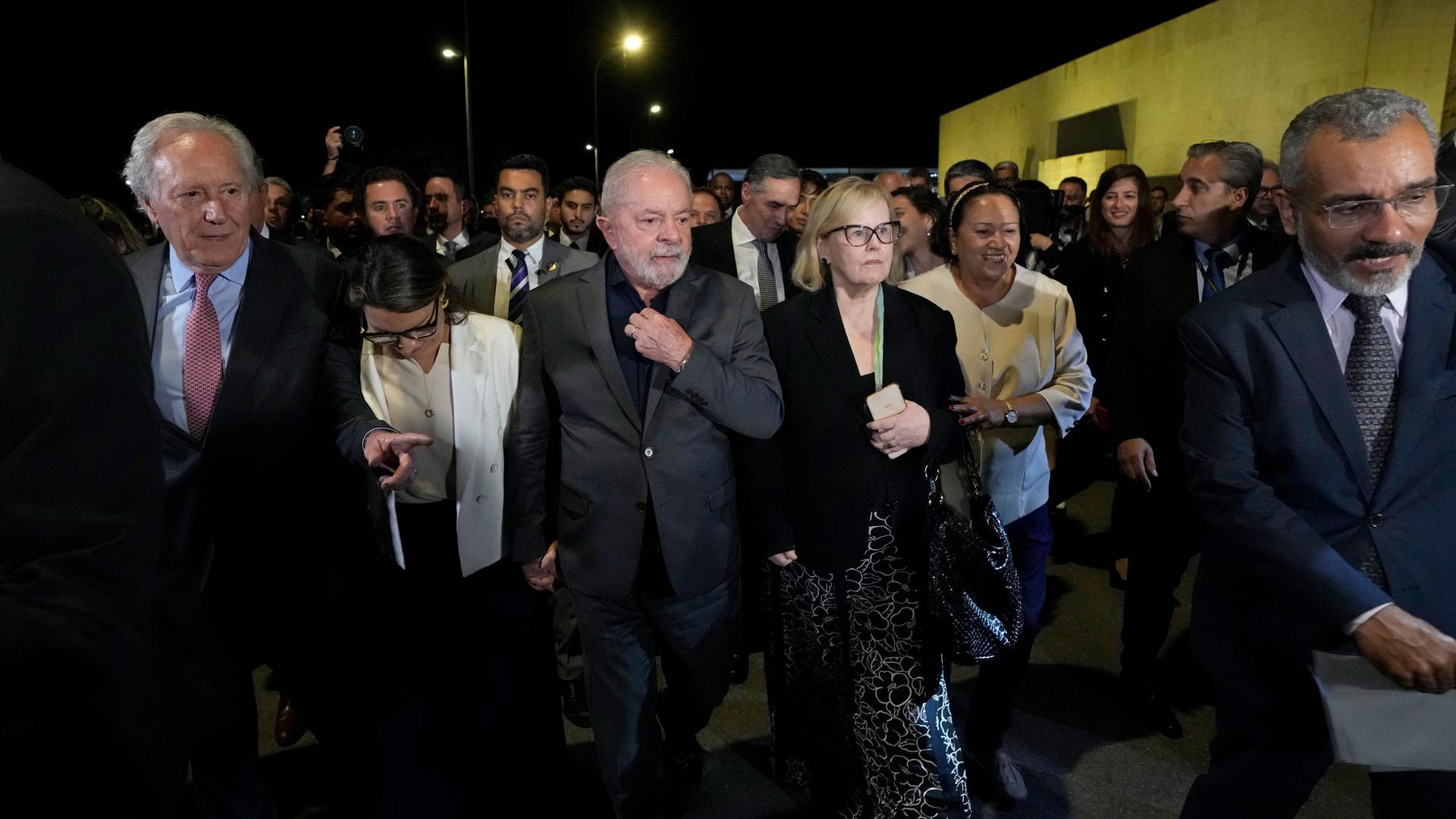 Brazil's President Luiz Inacio Lula da Silva, center, President of the Supreme Court Rosa Weber, center right, are accompanied by governors and ministers for an inspection visit and support for the Supreme Court headquarters.
