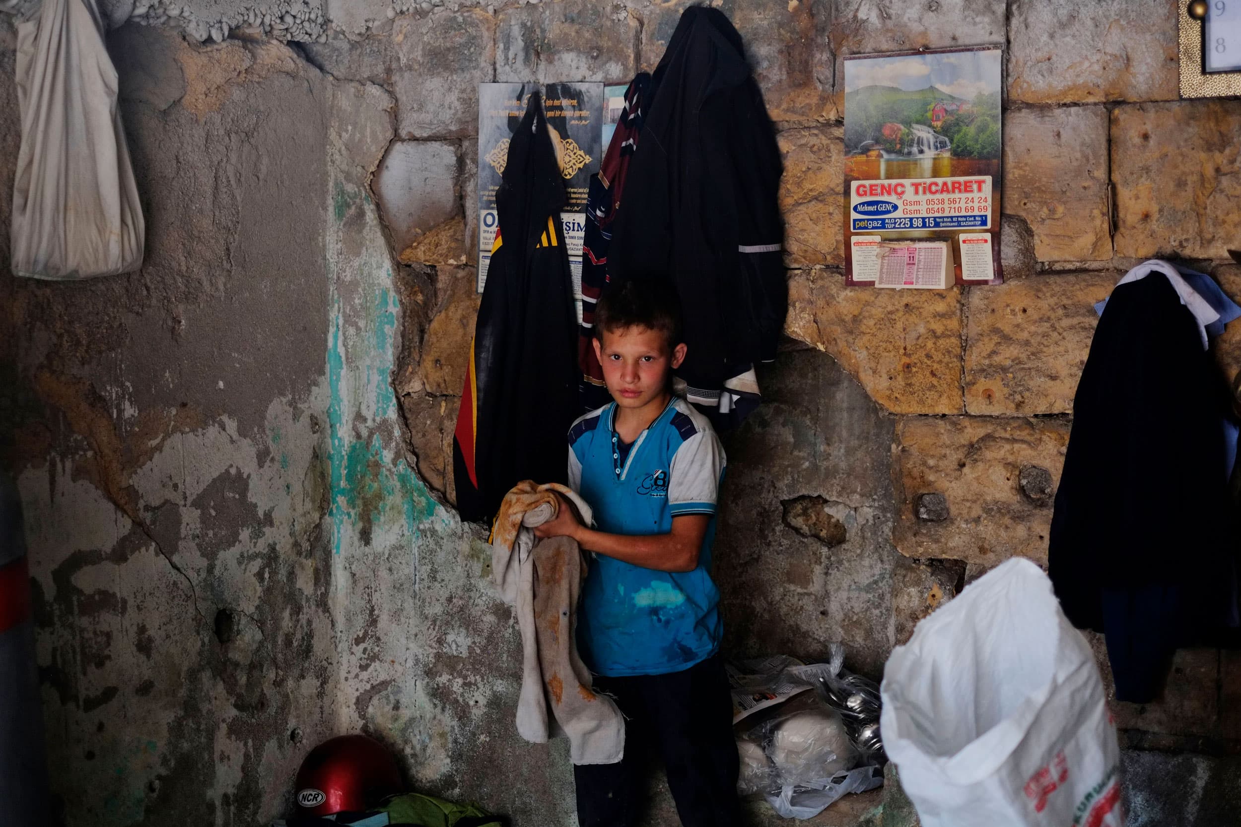 In this Thursday, June 2, 2016, photo, a Syrian refugee child works at a copper workshop in Gaziantep, southeastern Turkey.
