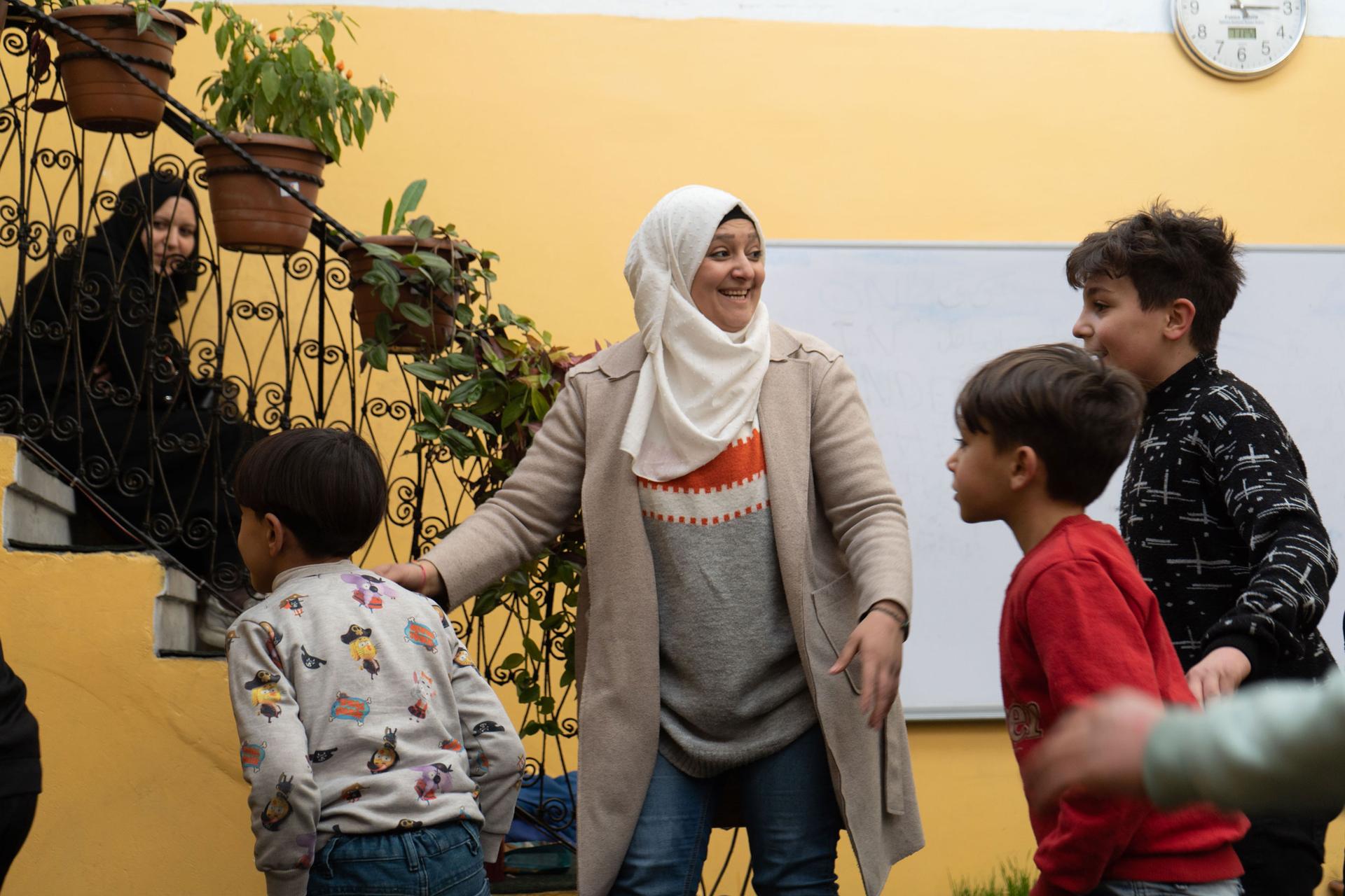 Hibah Jahjah interacts with children at Kids Rainbow, an alternative learning space.