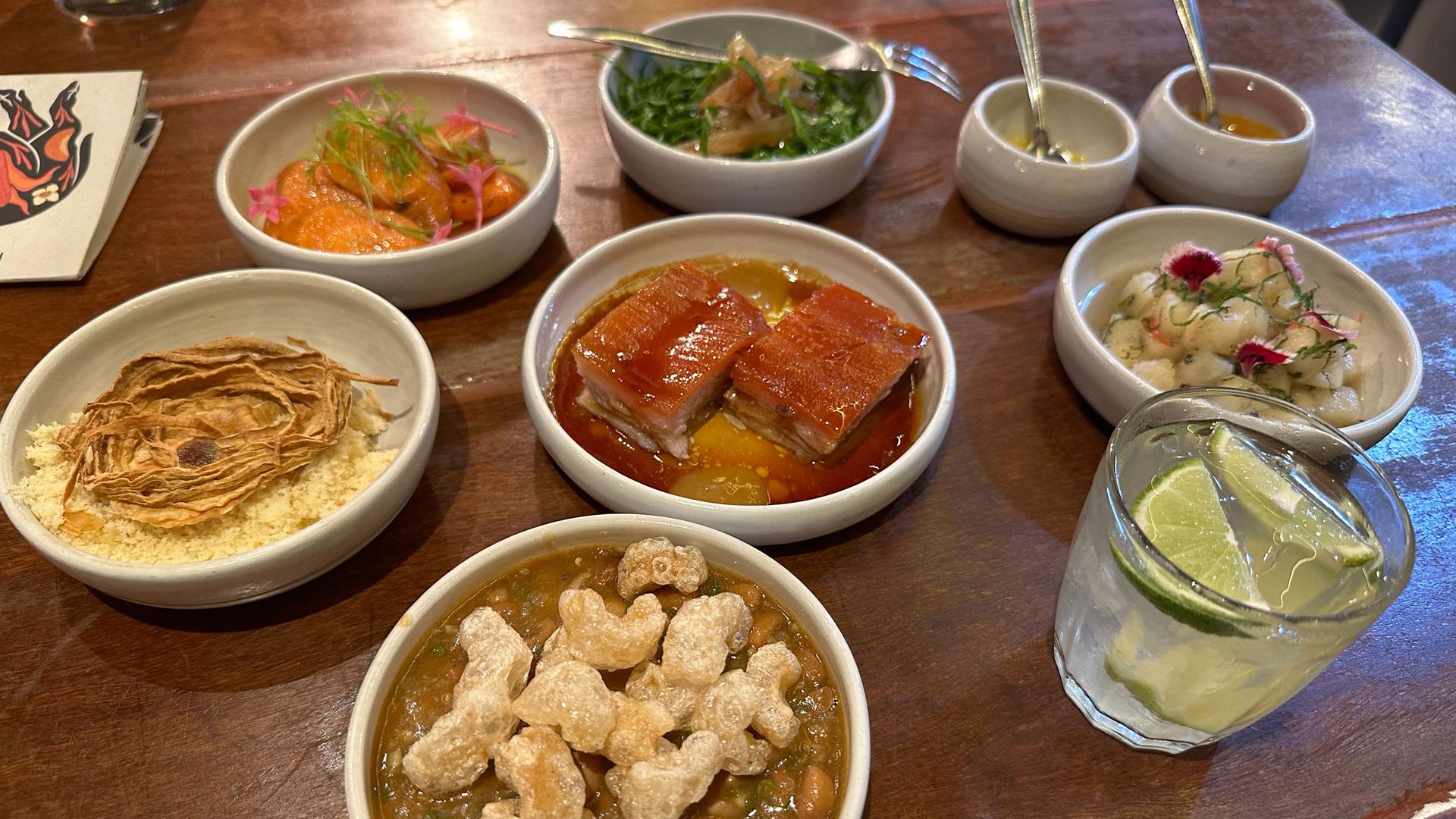 One of the main dishes at The Pork House includes a crunchy roasted pork with beans and fresh vegetables and is paired with the Brazilian national drink: caipirinha. 