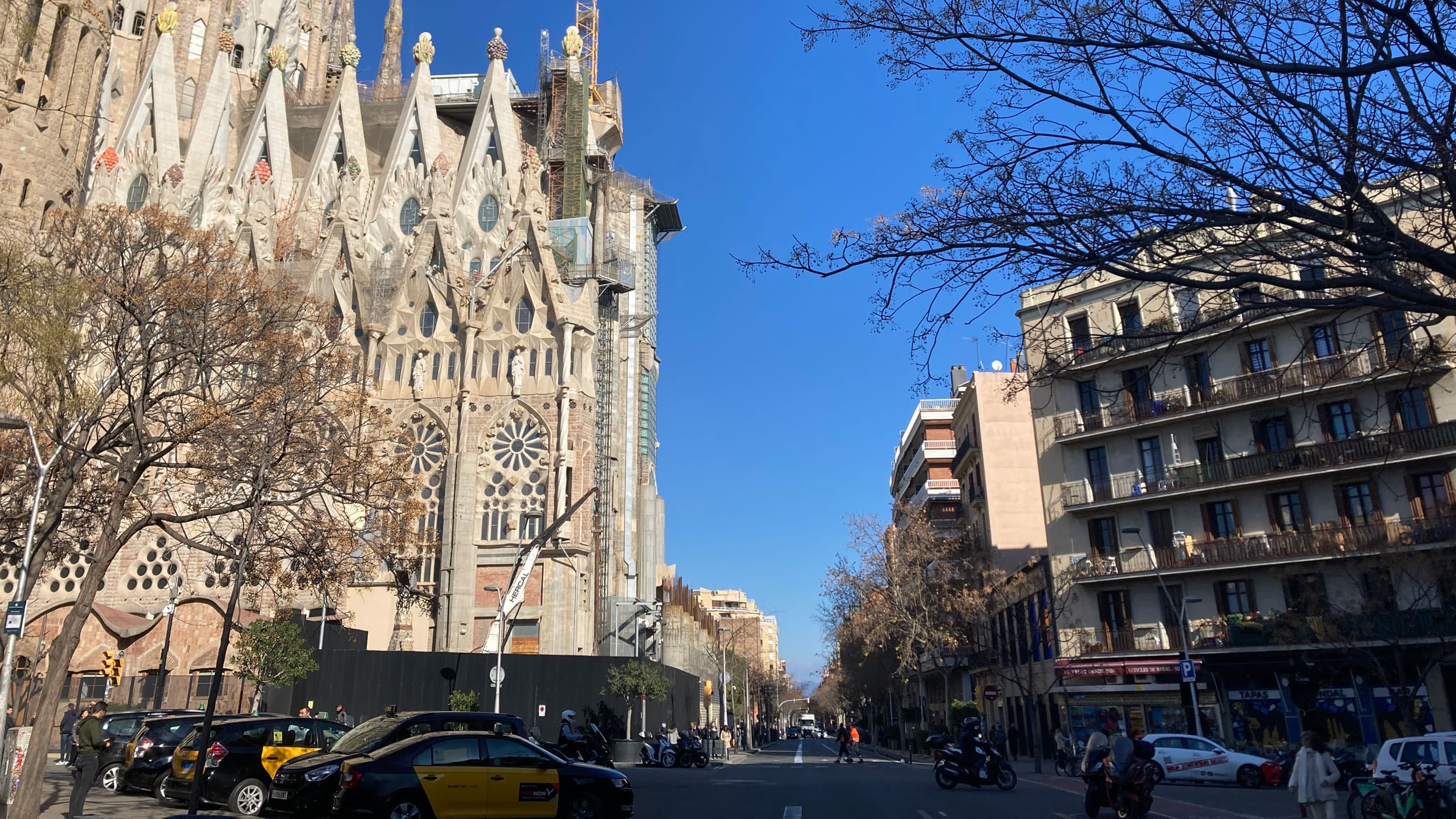The Sagrada Familia, with its incomplete Glory facade, faces an apartment complex that could get demolished if construction plans go through.