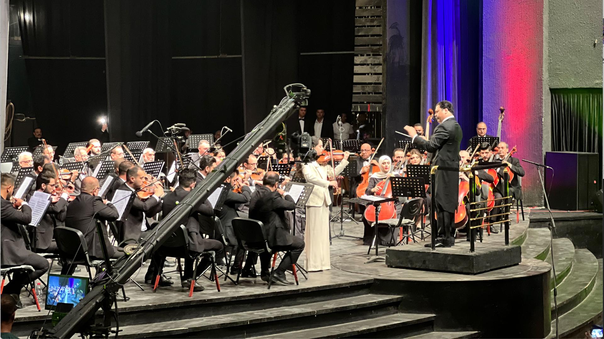 Iraqi cellist and conductor Karim Wasfi leads a performance at the National Theatre in Iraq, Baghdad, March 11, 2023.