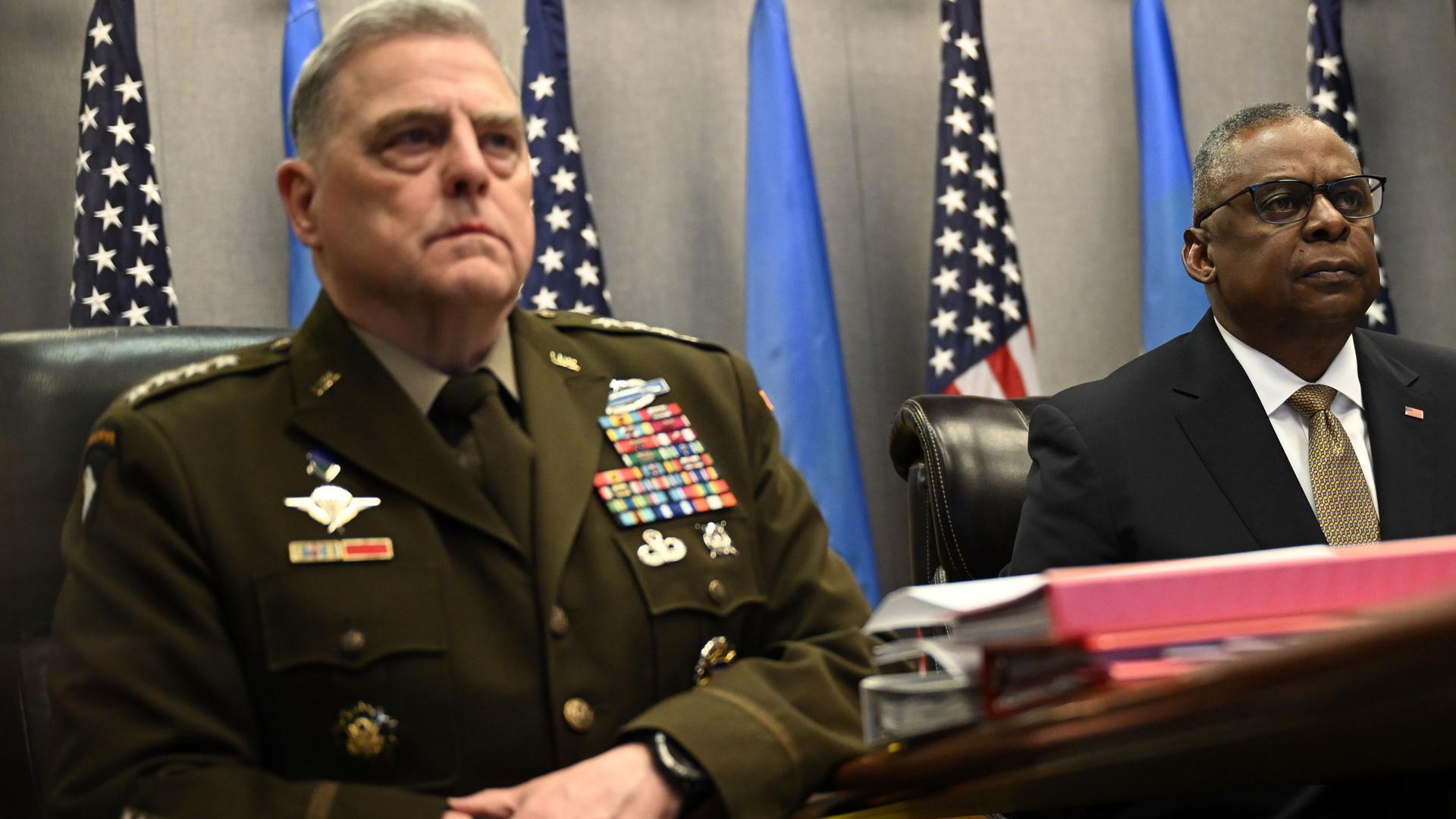 Defense Secretary Lloyd Austin, right, and Chairman of the Joint Chiefs of Staff Gen. Mark Milley, attend a virtual meeting of the Ukraine Defense Contact Group, Wednesday, March 15, 2023, at the Pentagon in Washington. 