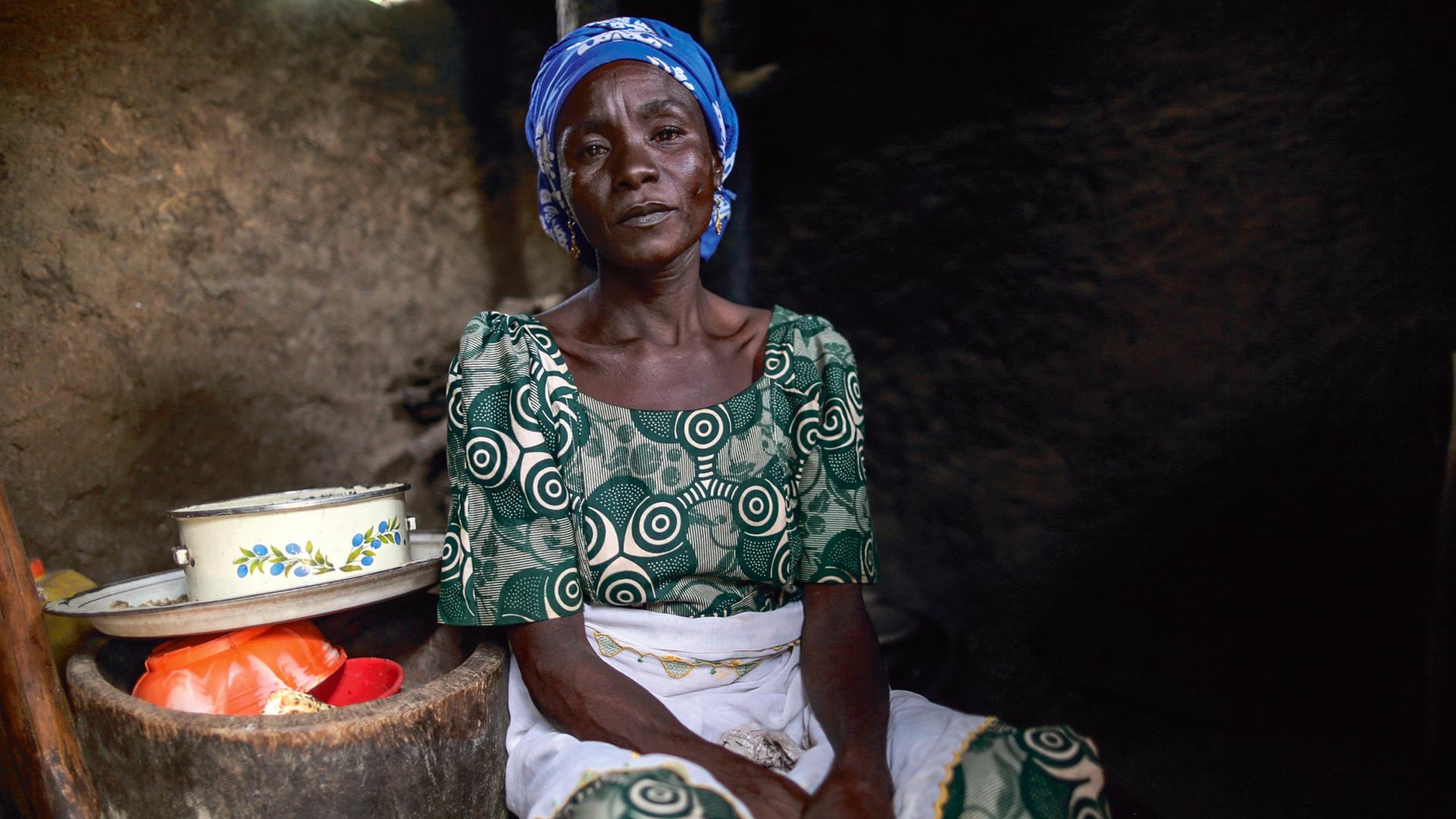 Rifkatu Samuel, the mother of Lugwa Samuel, is pictured in her kitchen in Chibok. She wrote an essay for the book 