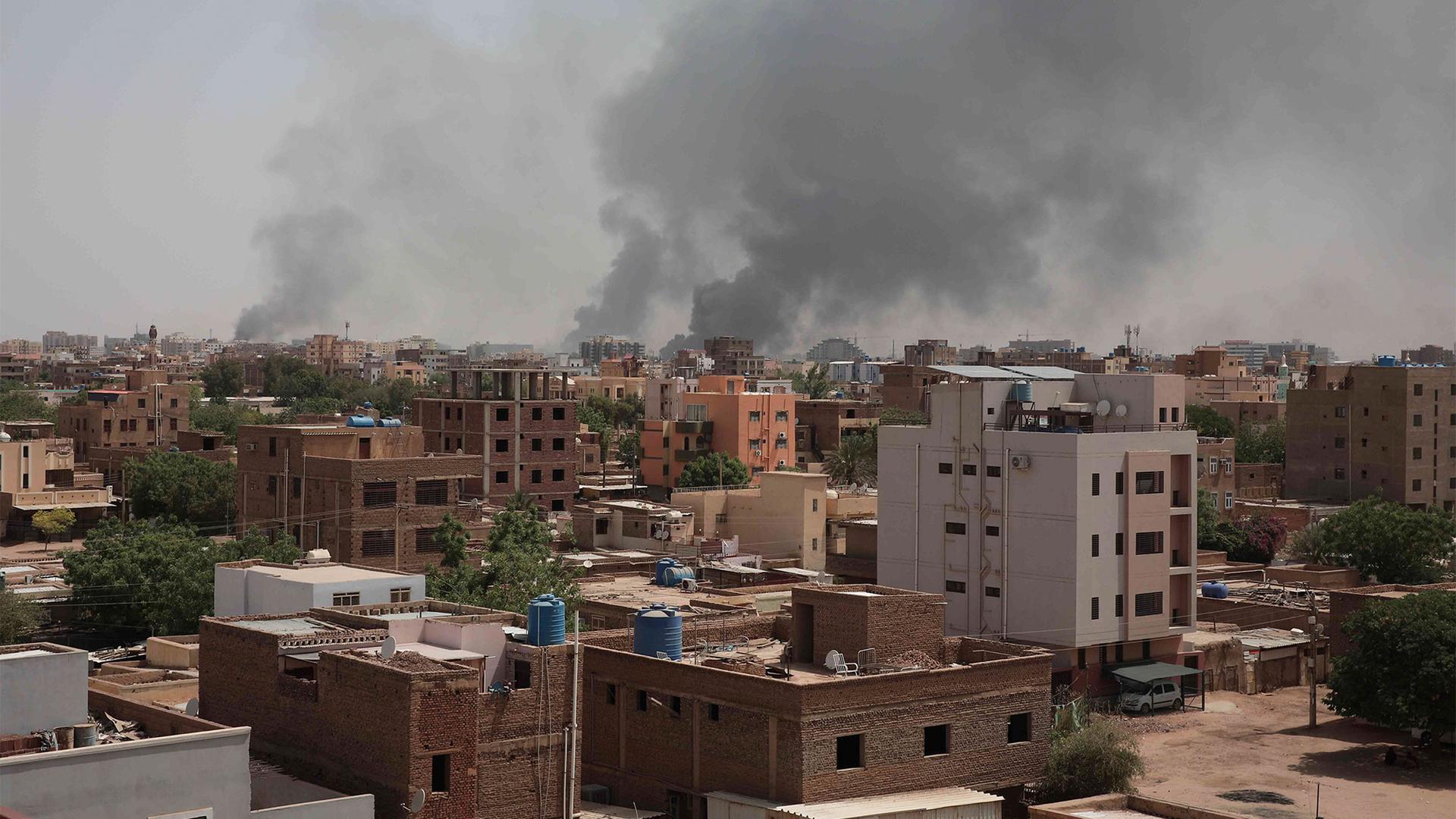Smoke rises from a central neighborhood of Khartoum, Sudan, amid intense fighting between armed forces, April 16, 2023.