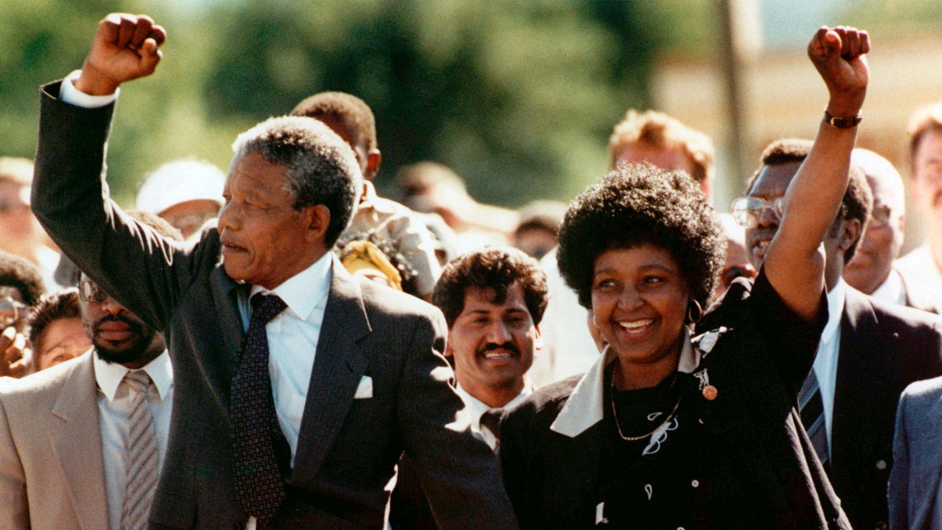 Nelson Mandela, left, and his wife Winnie, raise clenched fists as they walk hand-in-hand from the Victor Verster prison near Cape Town, South Africa on Feb. 11, 1990.