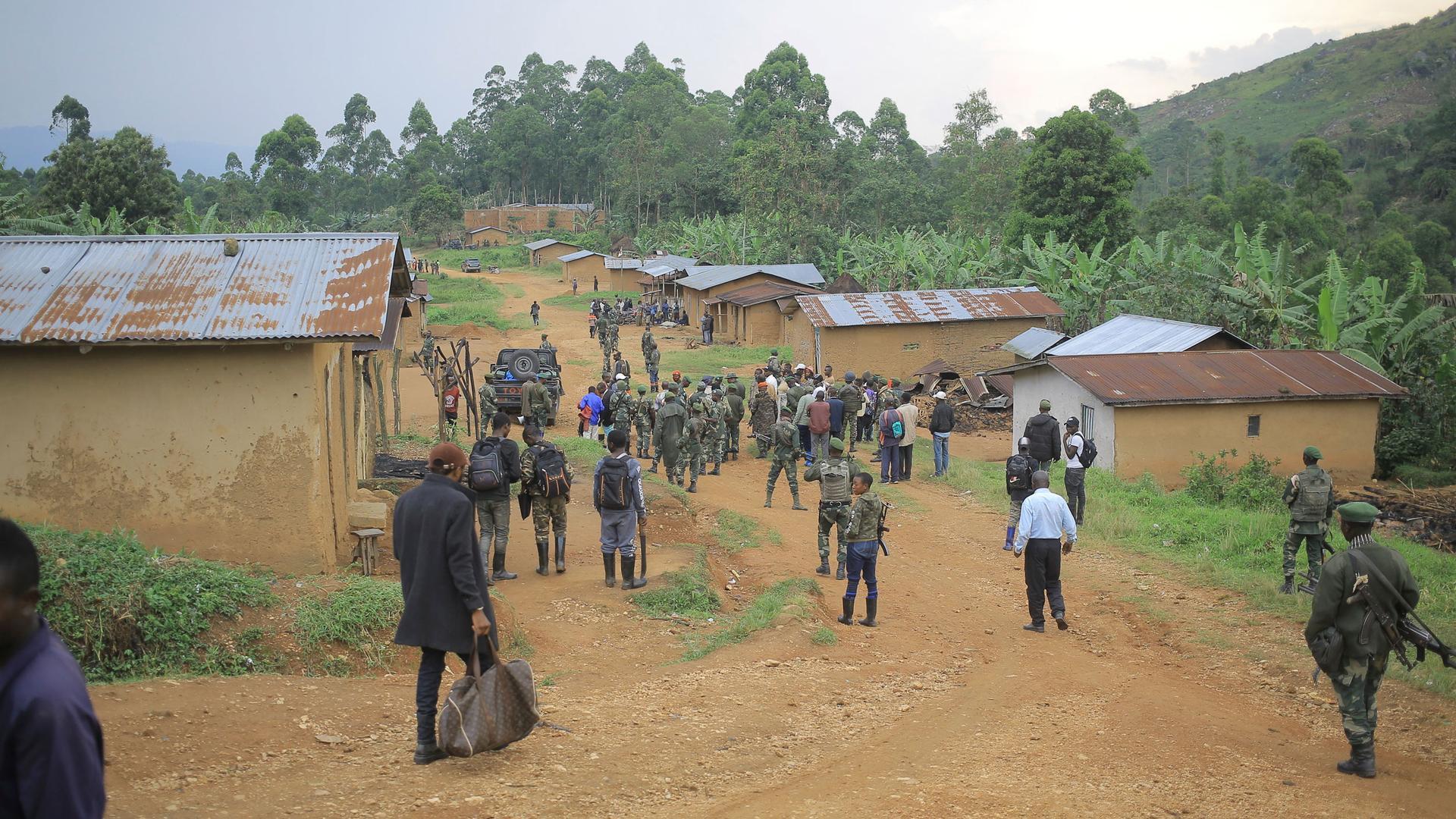 Democratic Republic of Congo Defense Forces gather in the North Kivu province village of Mukondi, Thursday March 9, 2023. 