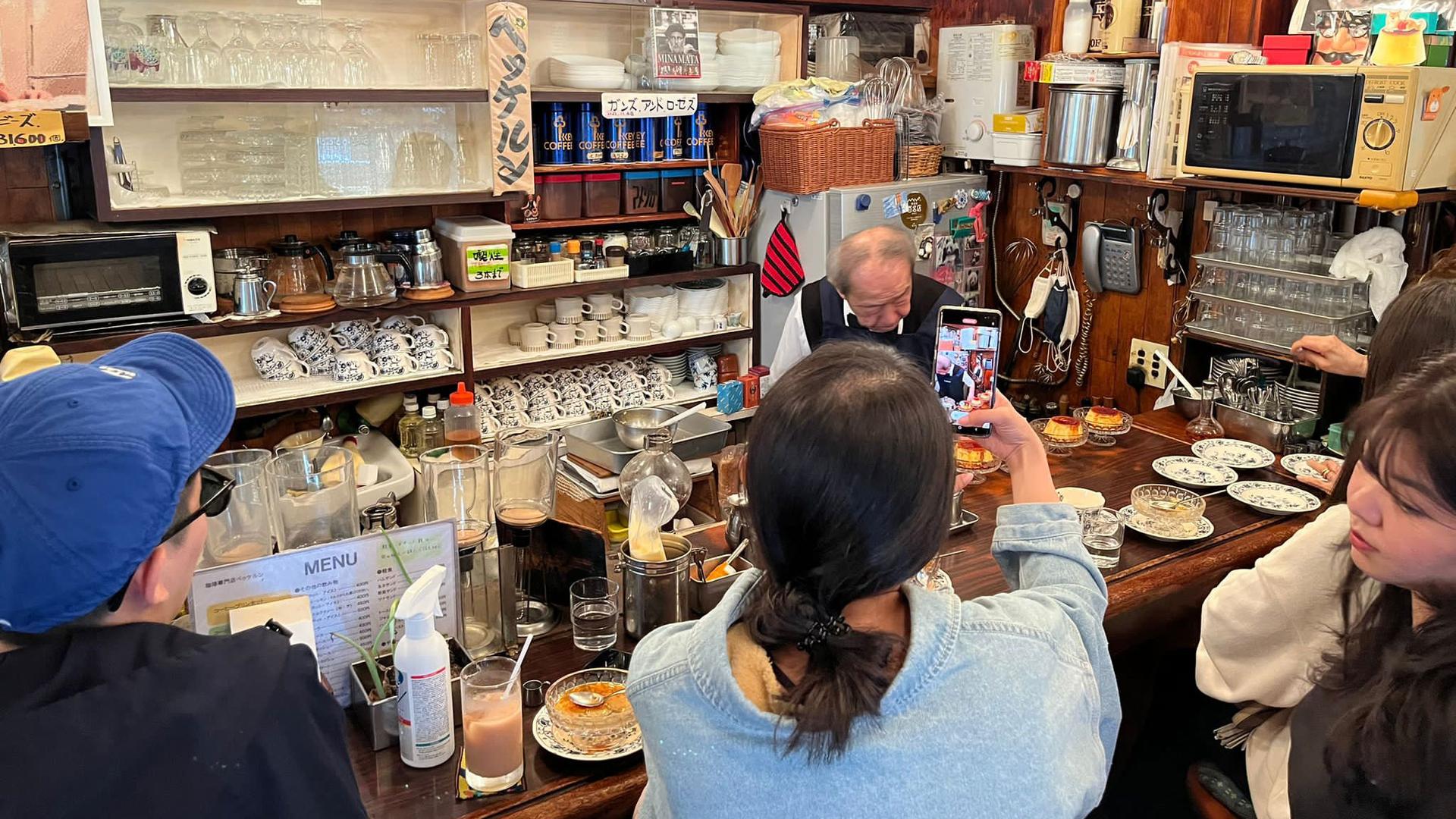 Customers get out their smartphones and go silent as Shizuo Mori begins his pudding-fling serving technique that made him a viral sensation.