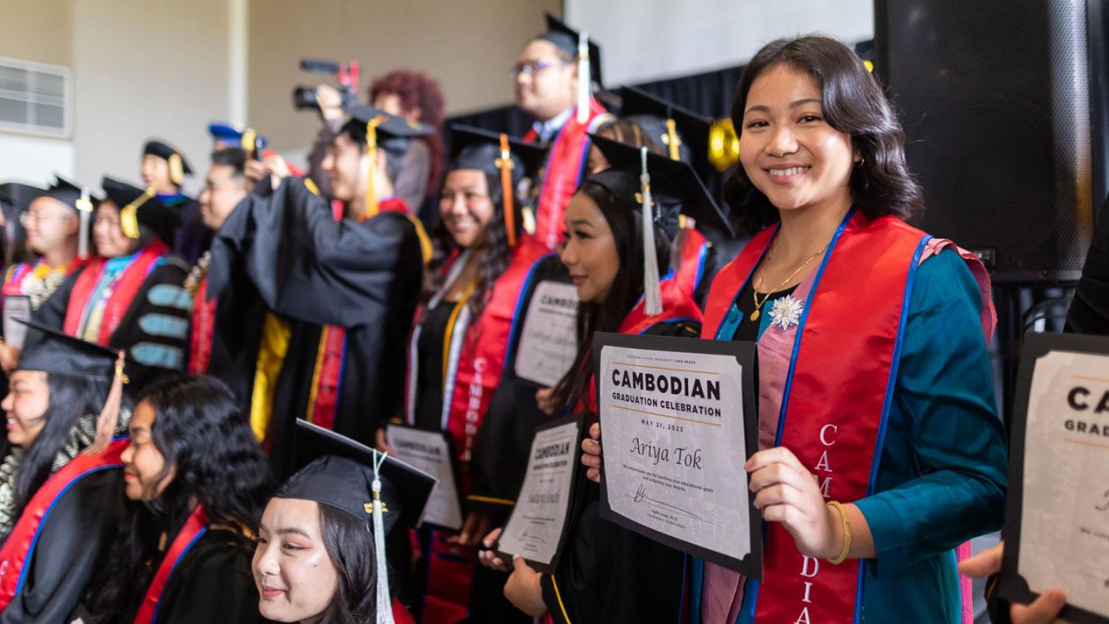 Ariya Tok poses with her fellow graduates after they received their certificates at a Cambodian cultural graduation ceremony at Cal State Long Beach.