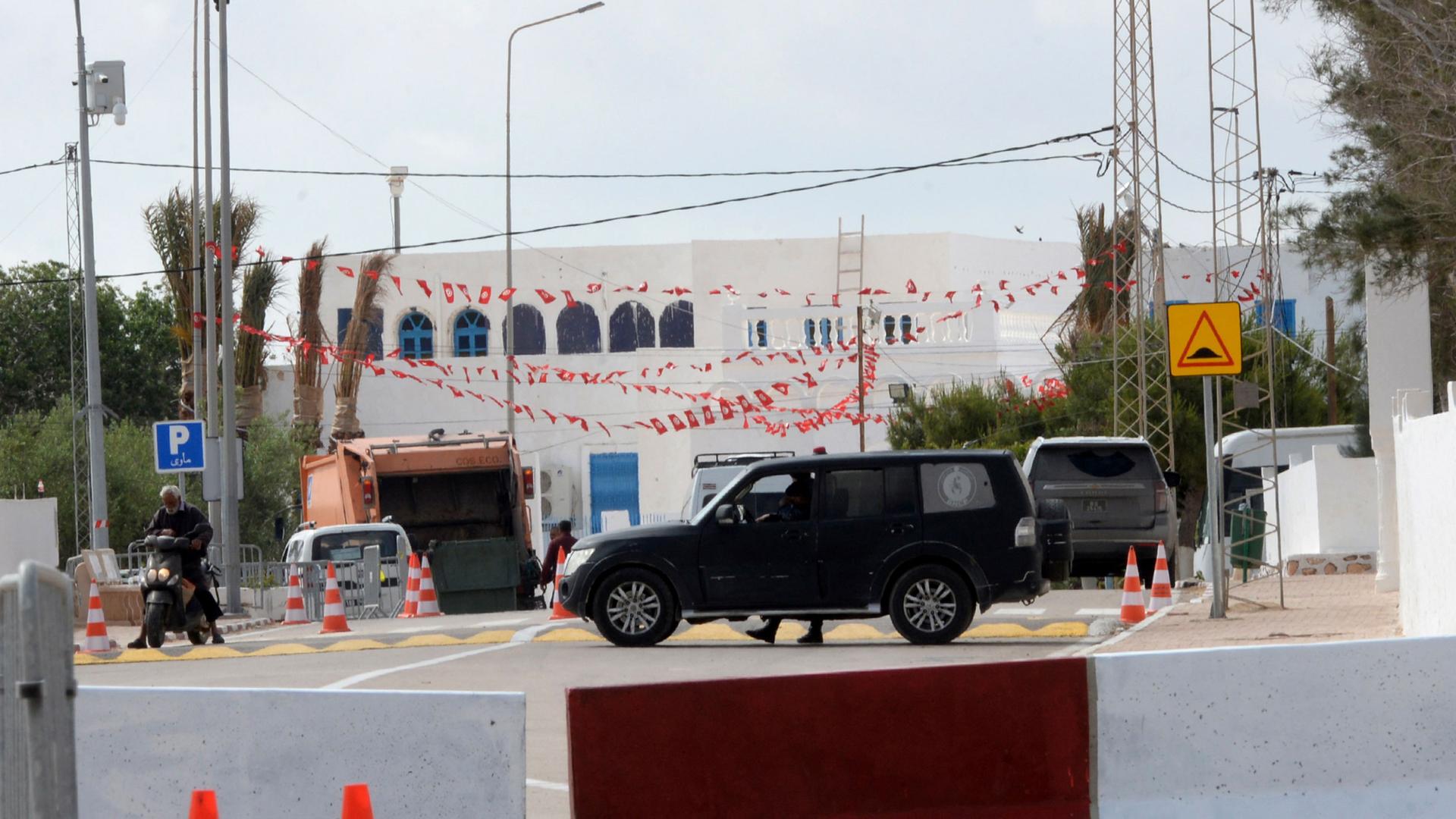 A police car is parked near Ghriba synagogue in Djerba, Tunisia, May 10, 2023.