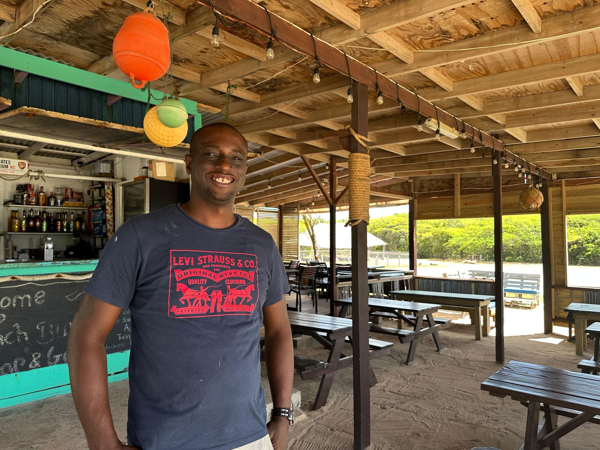 Avery Henry, the owner of Beach Bum Bar and Grill on Half Moon Bay, was dealing with an empty restaurant as sargassum filled the sand.