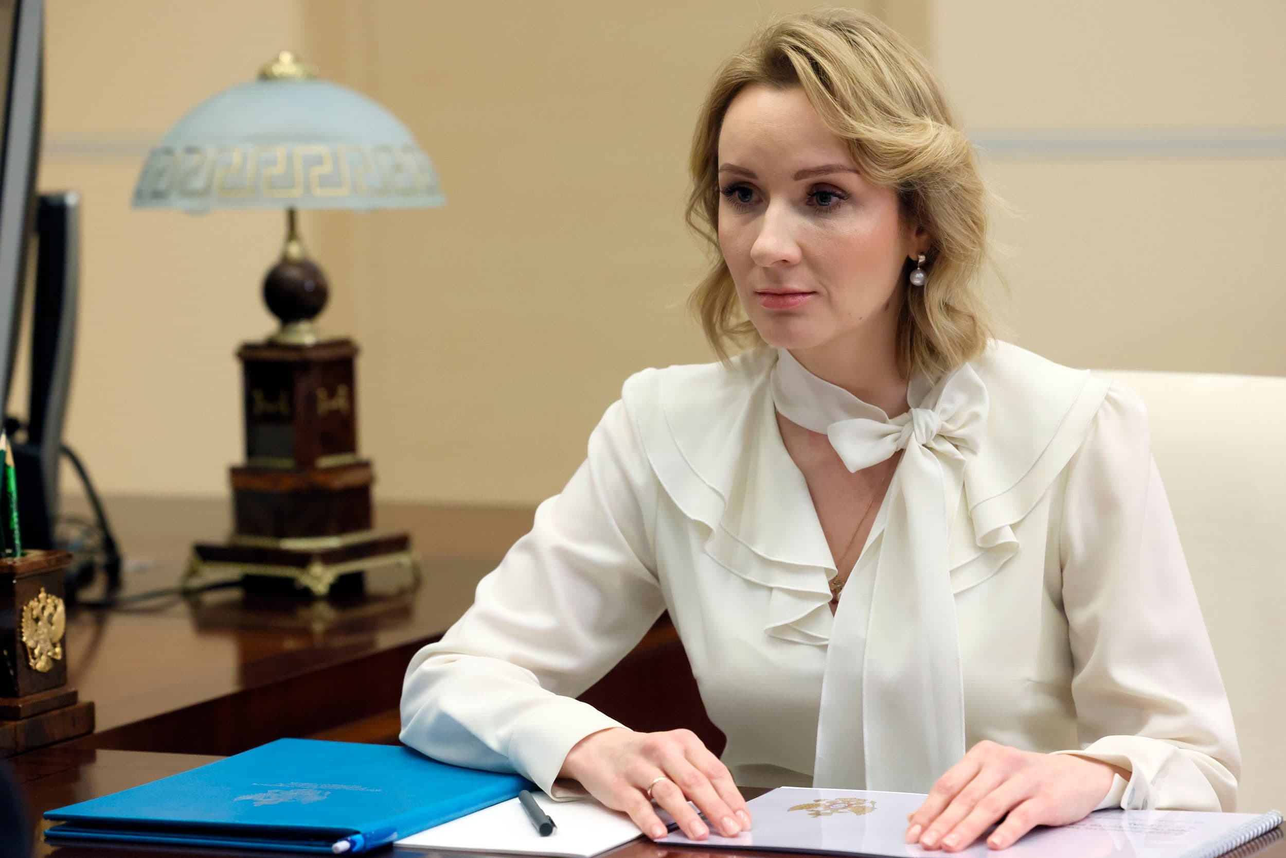 Russian Presidential Commissioner for Children's Rights Maria Lvova-Belova speaks to Russian President Vladimir Putin at the Novo-Ogaryovo state residence, outside Moscow, Russia, on Feb. 16, 2023.